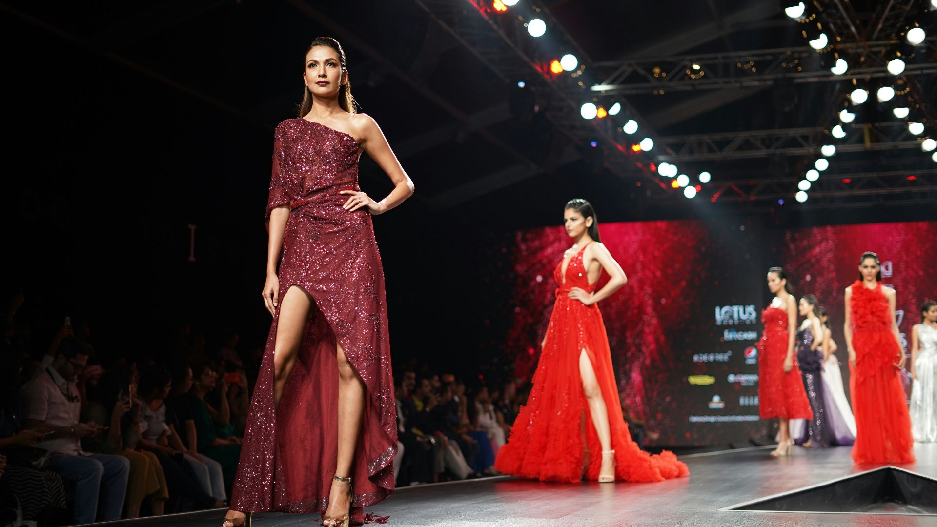woman wearing maroon one-shoulder slit-side dress