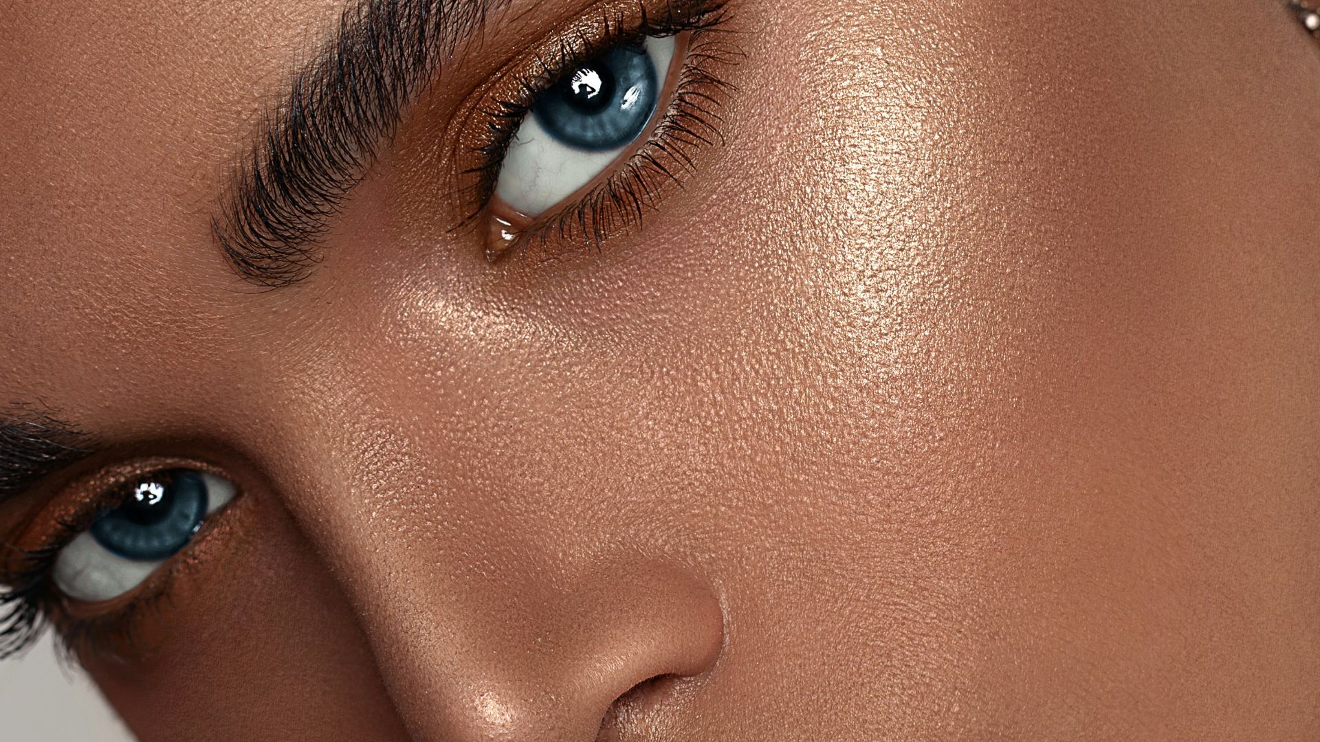 woman with red lipstick and gold hoop earrings