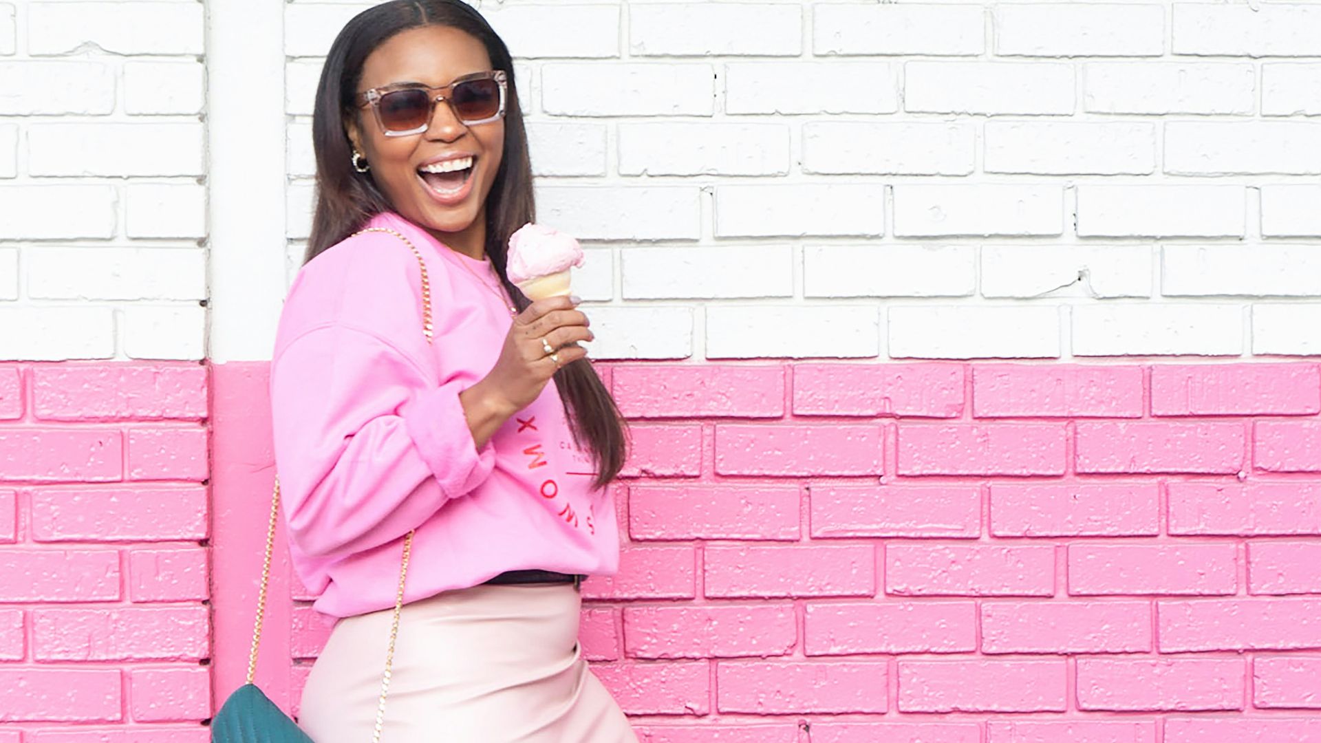 woman in pink long sleeve shirt and white skirt holding blue plastic hair comb