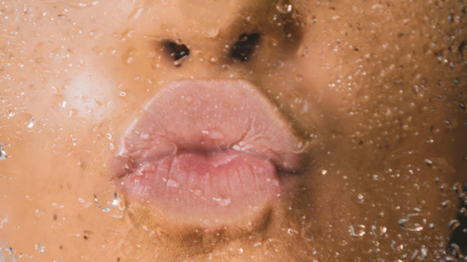 woman in water with water droplets