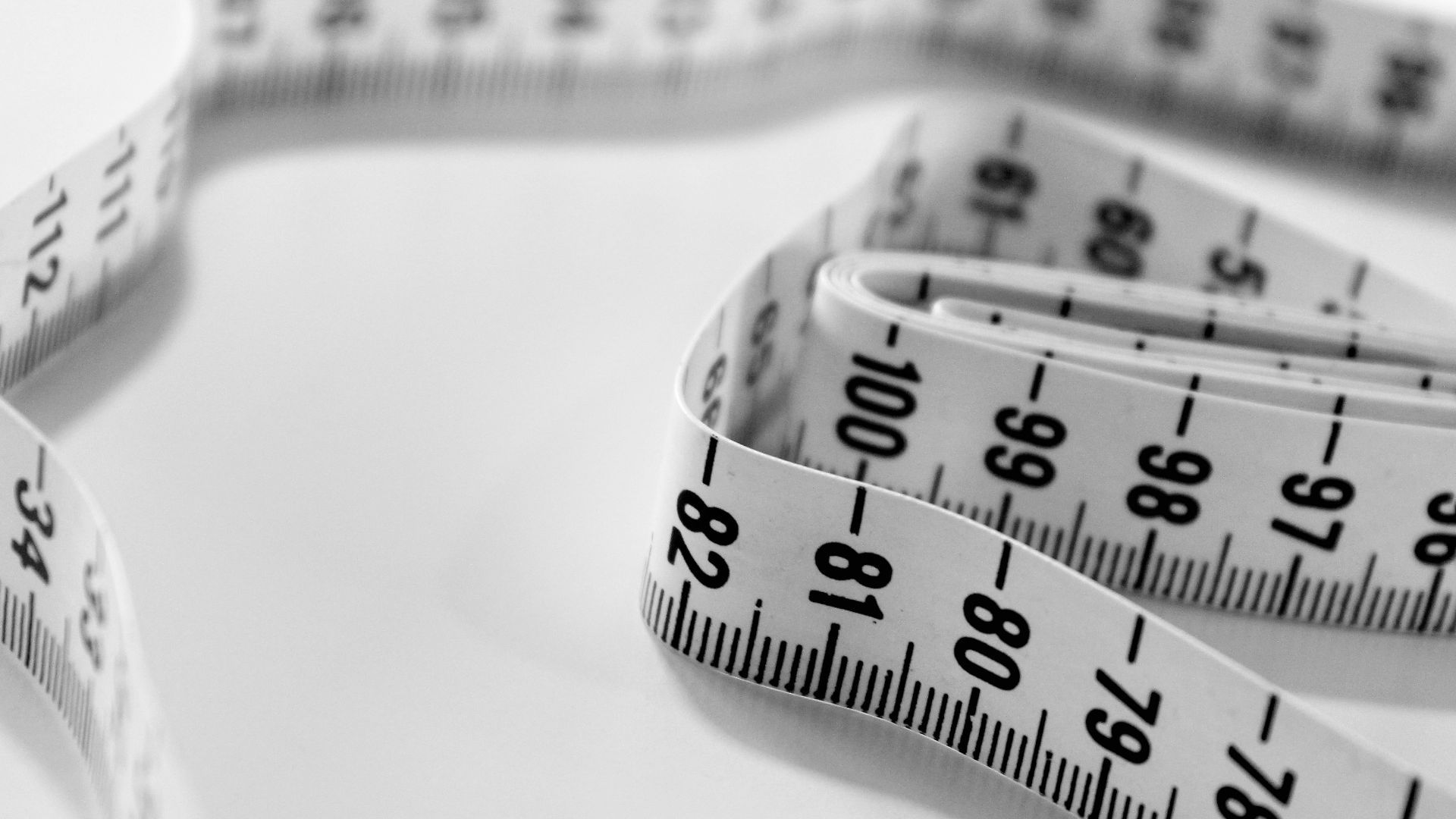 selective focus photography of tape measure