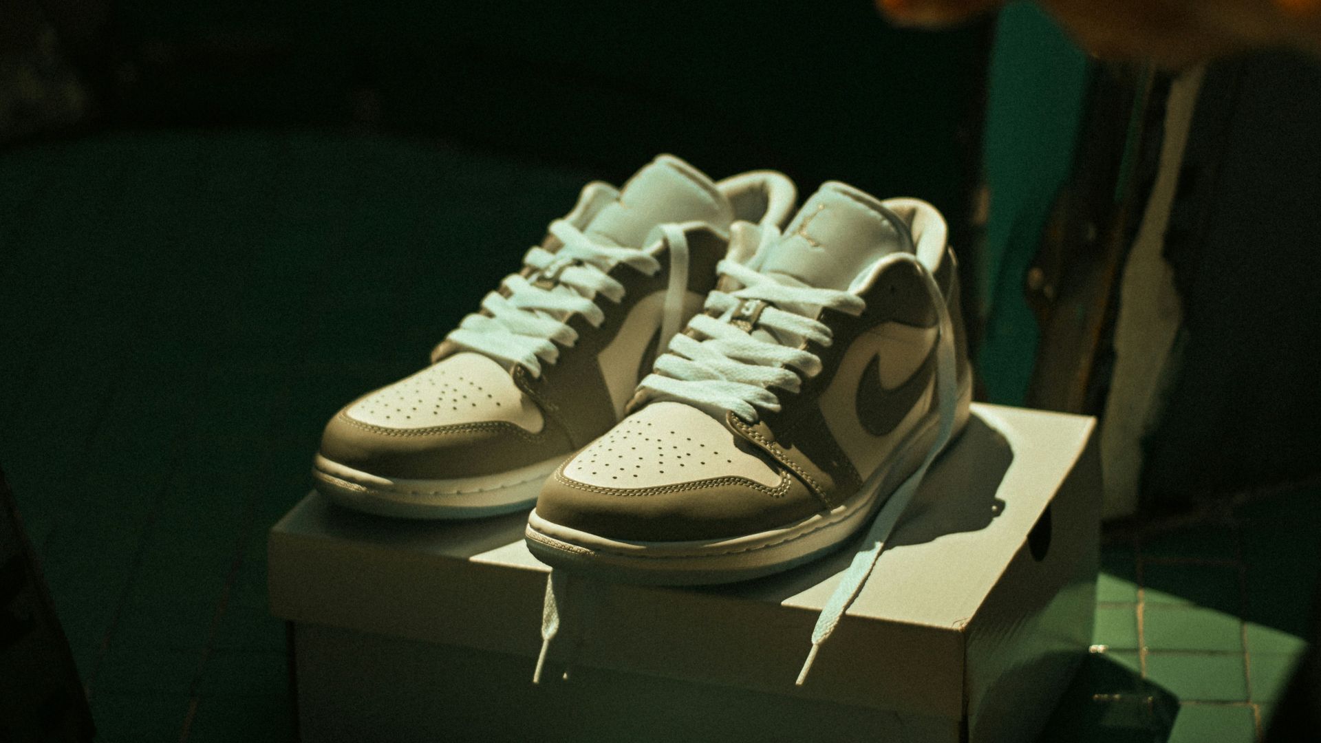 a pair of sneakers on display in a room