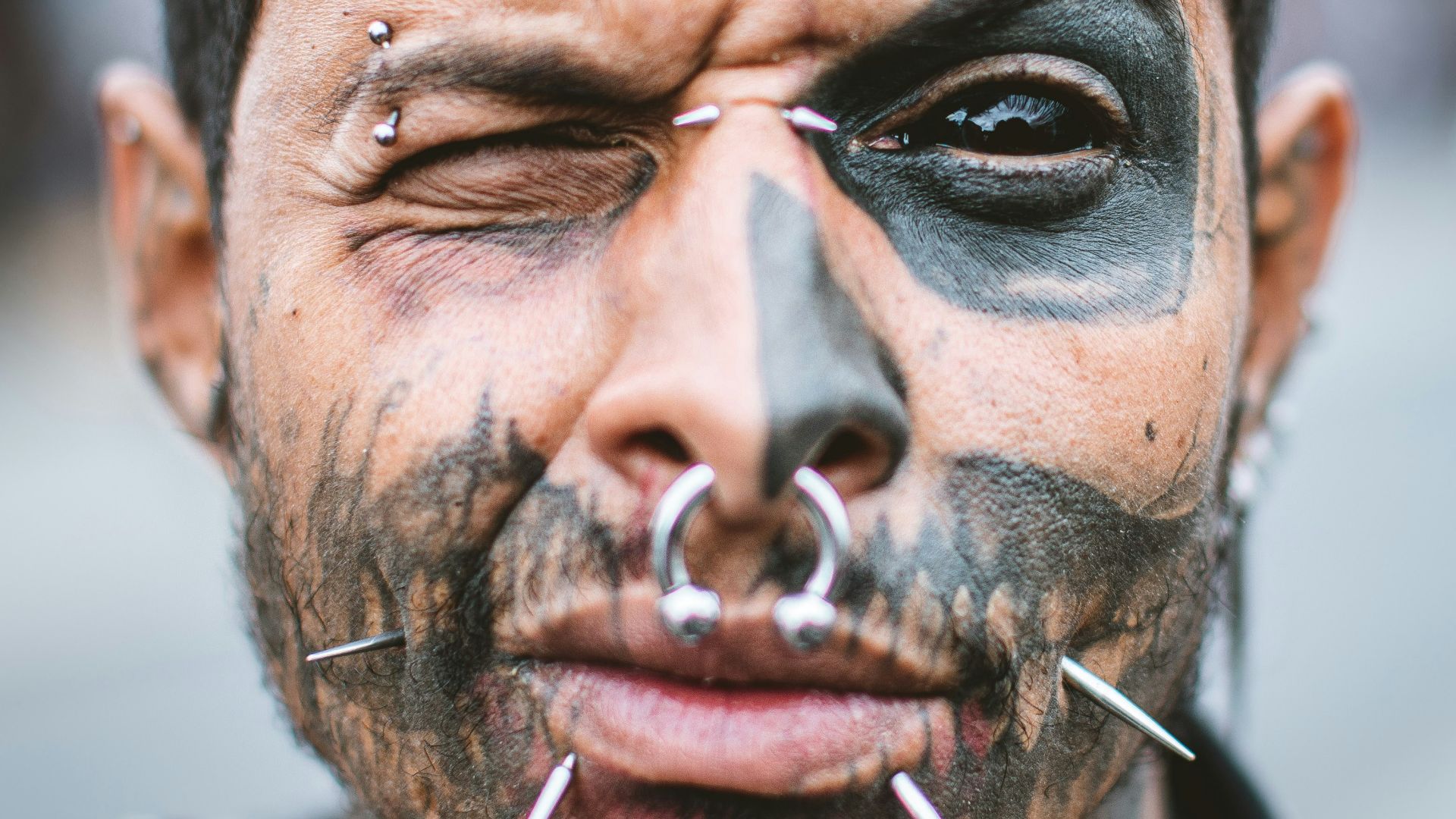 man with silver nose piercing