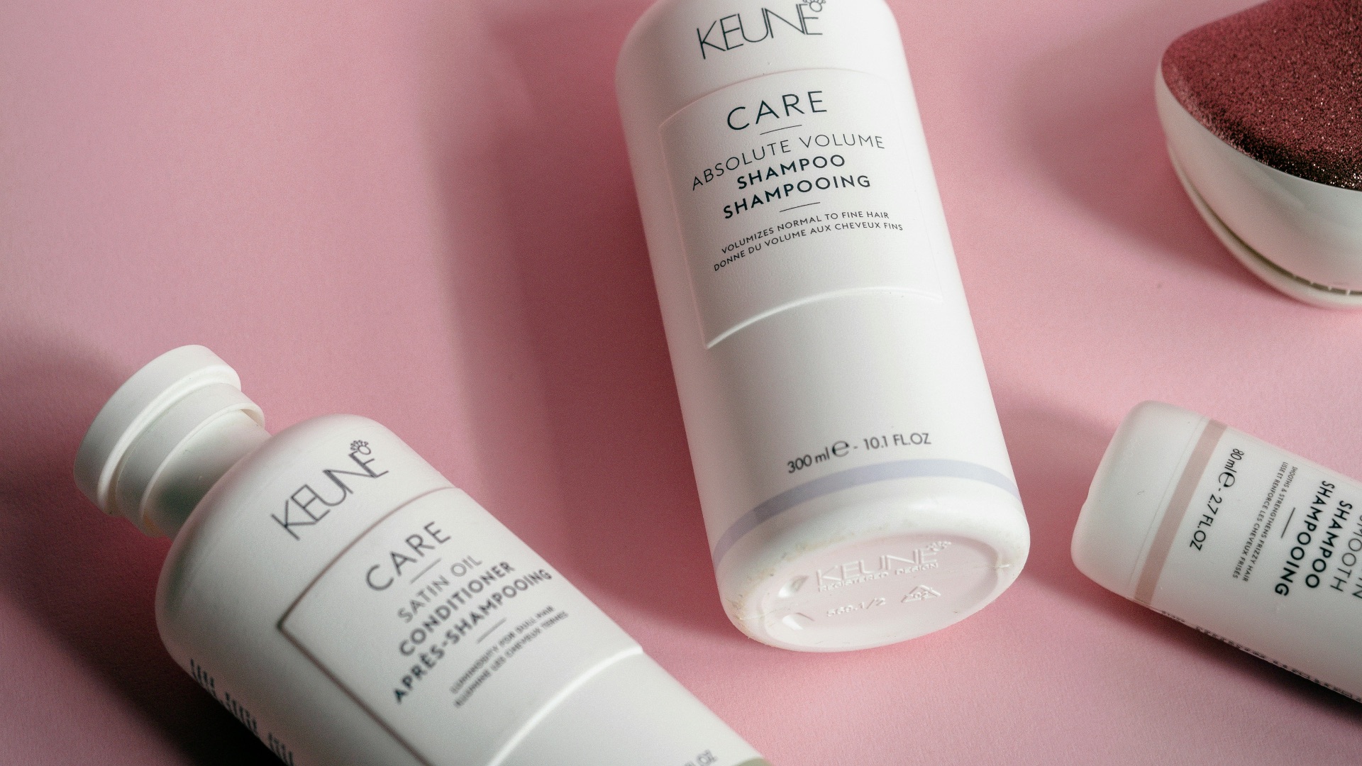 a bottle of keune care next to some other products