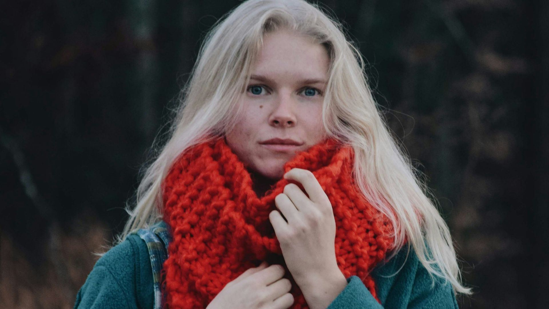 a person in a red scarf