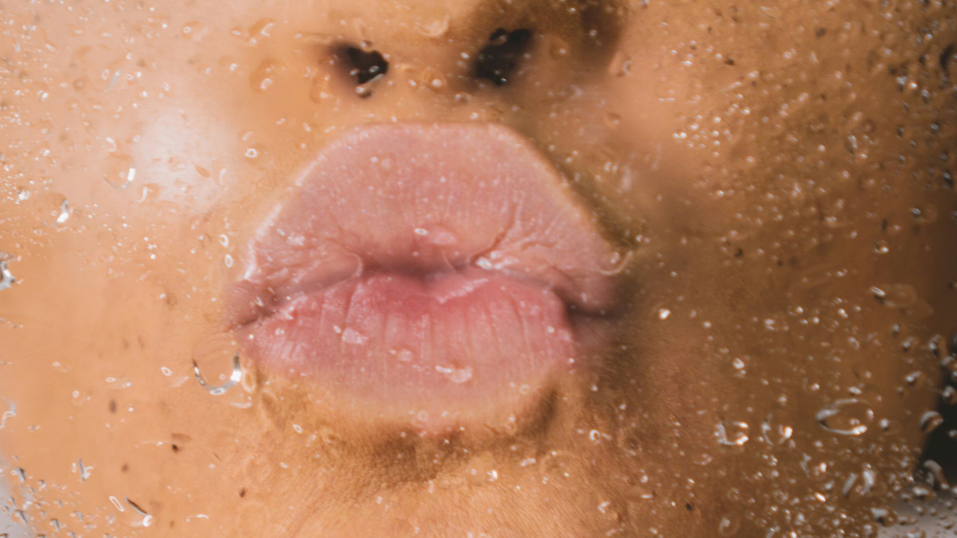 woman in water with water droplets