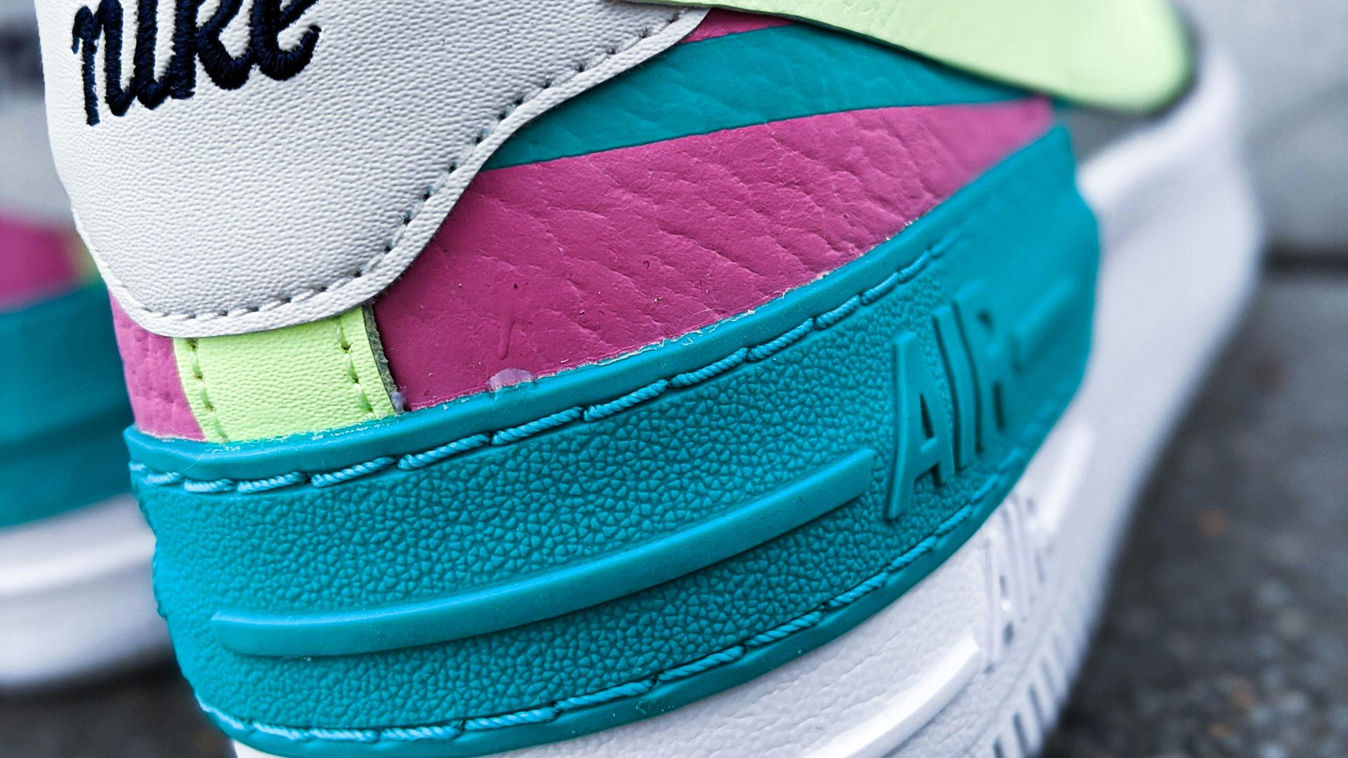 blue and pink nike shoe