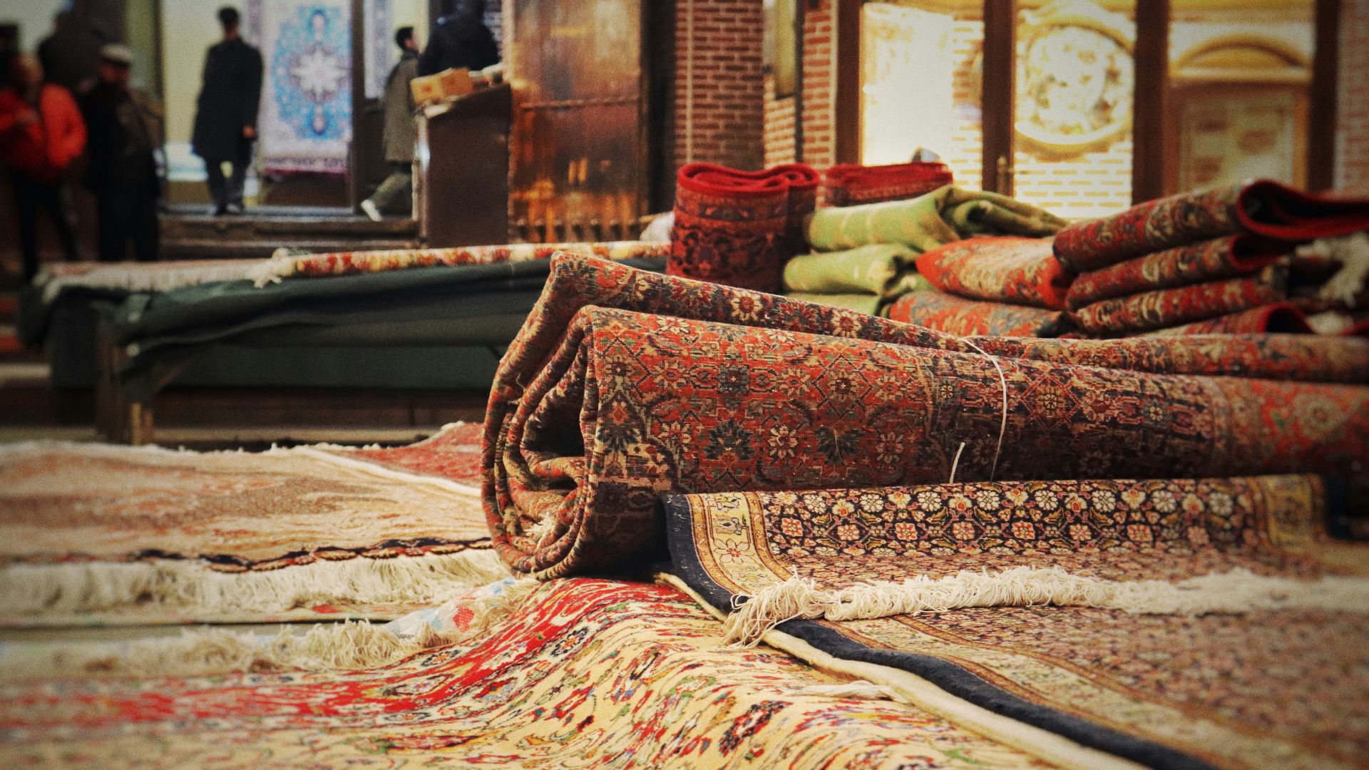 A pile of rugs sitting on top of a floor