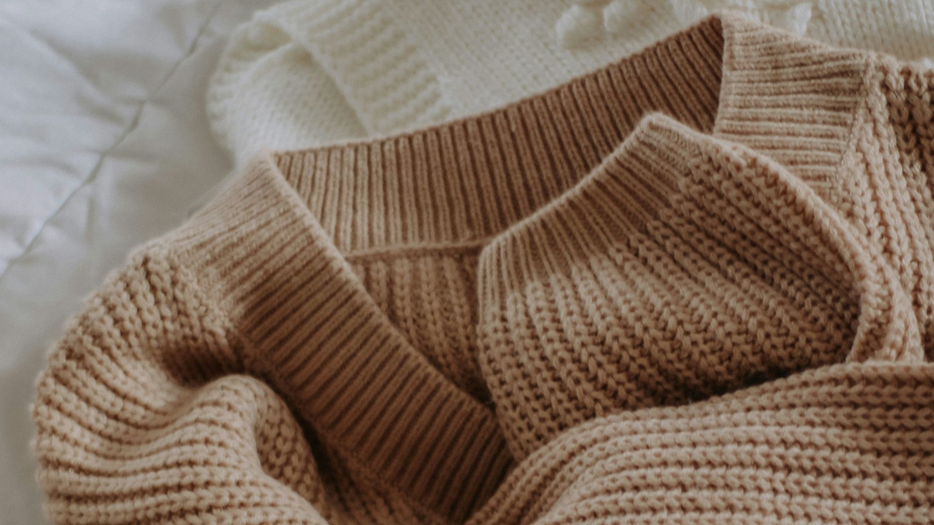 a brown towel on a white surface