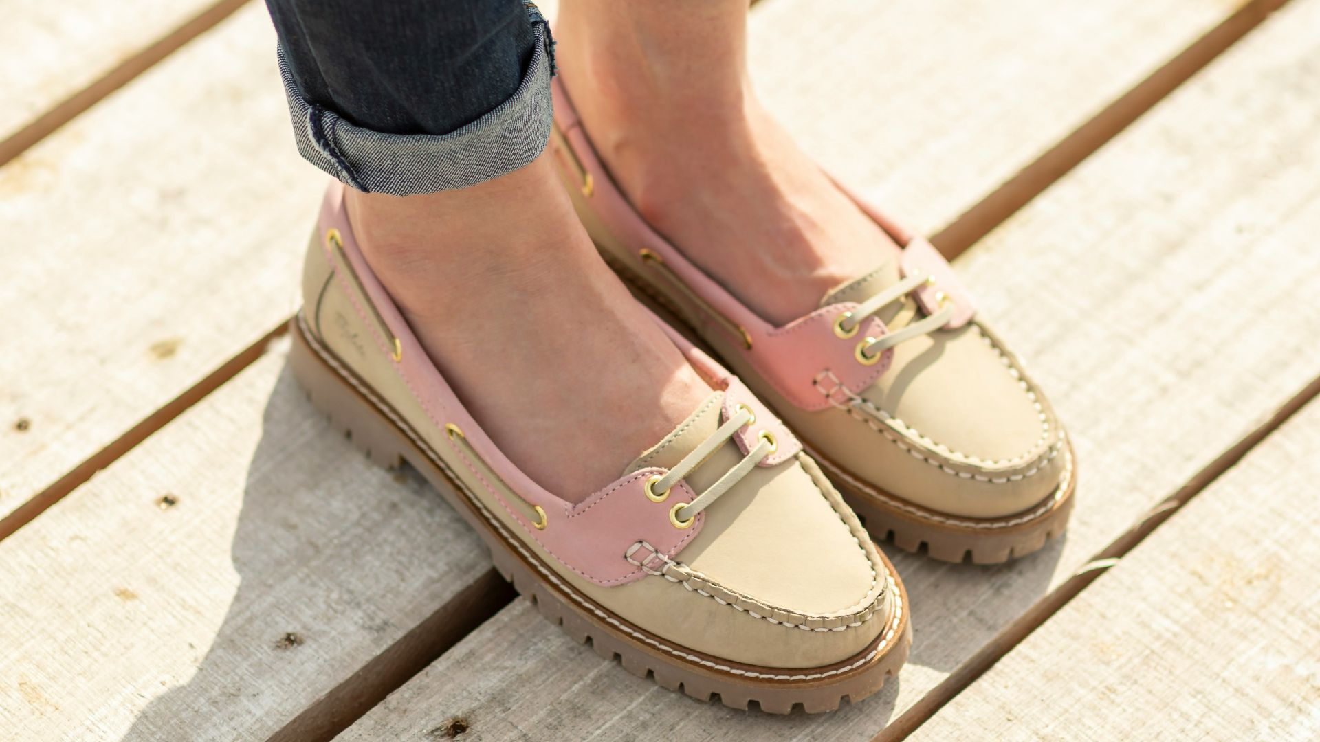 A woman standing on top of a wooden platform