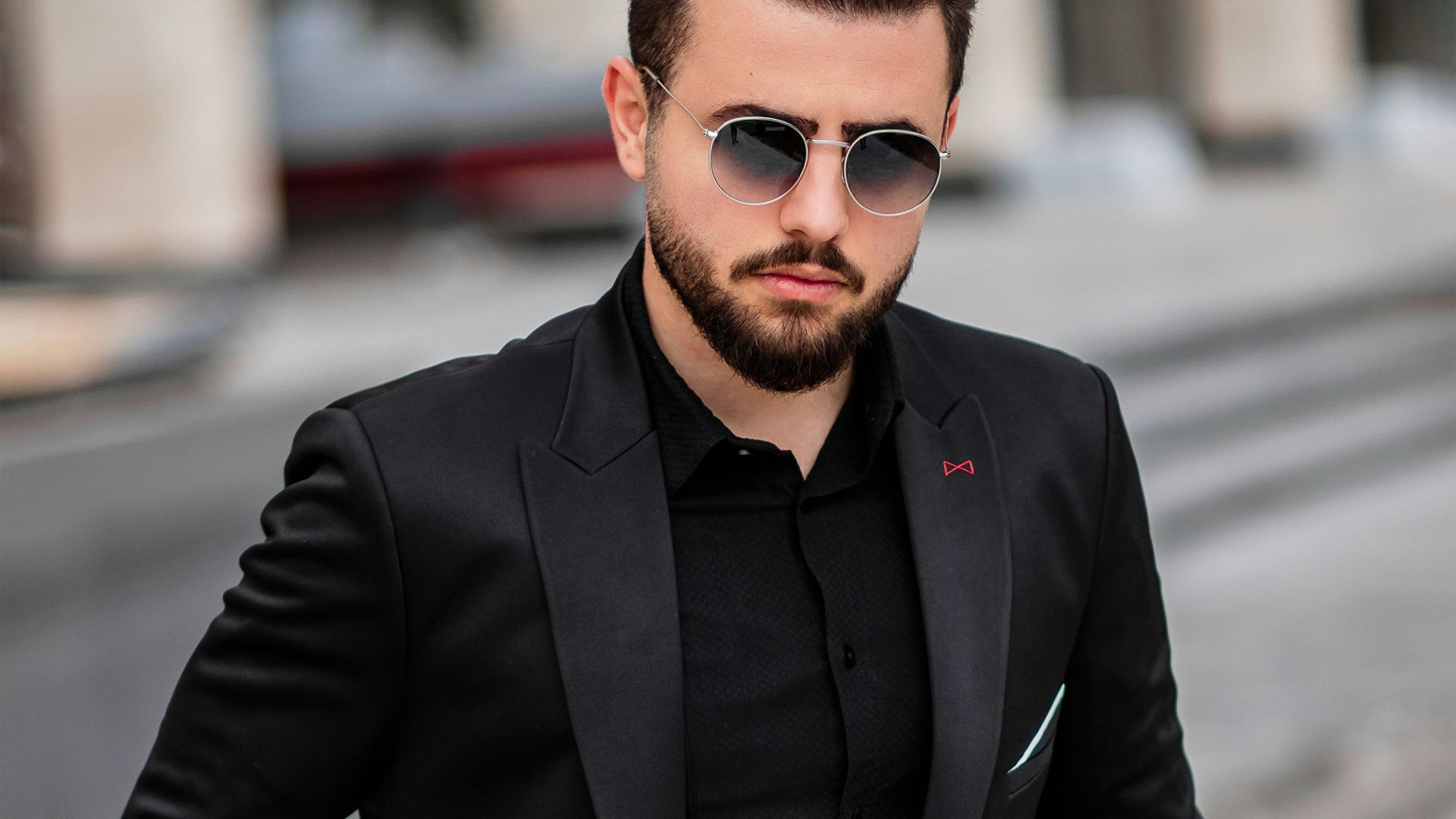 man in black suit jacket and black sunglasses