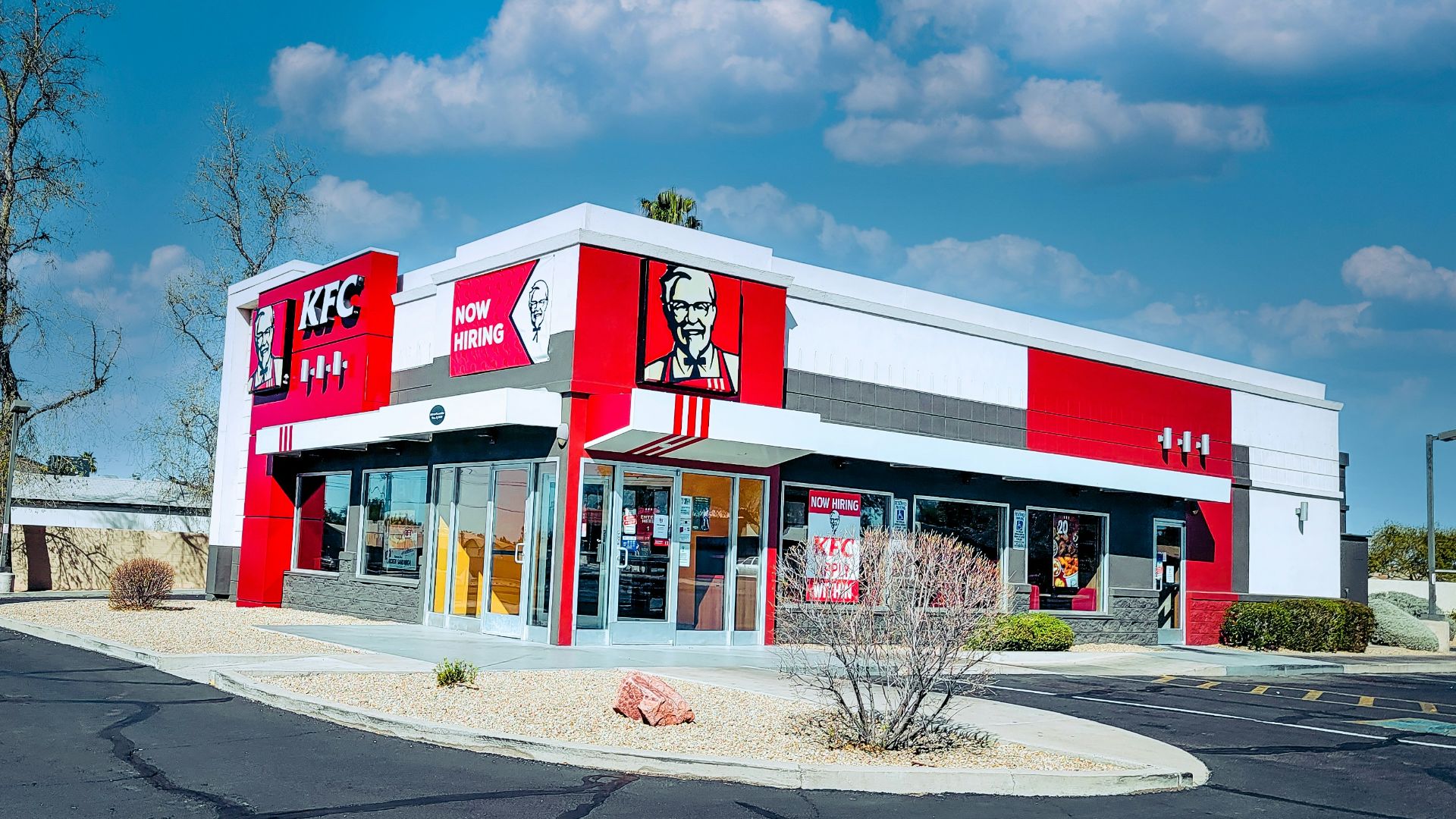 red and white concrete building under blue sky during daytime