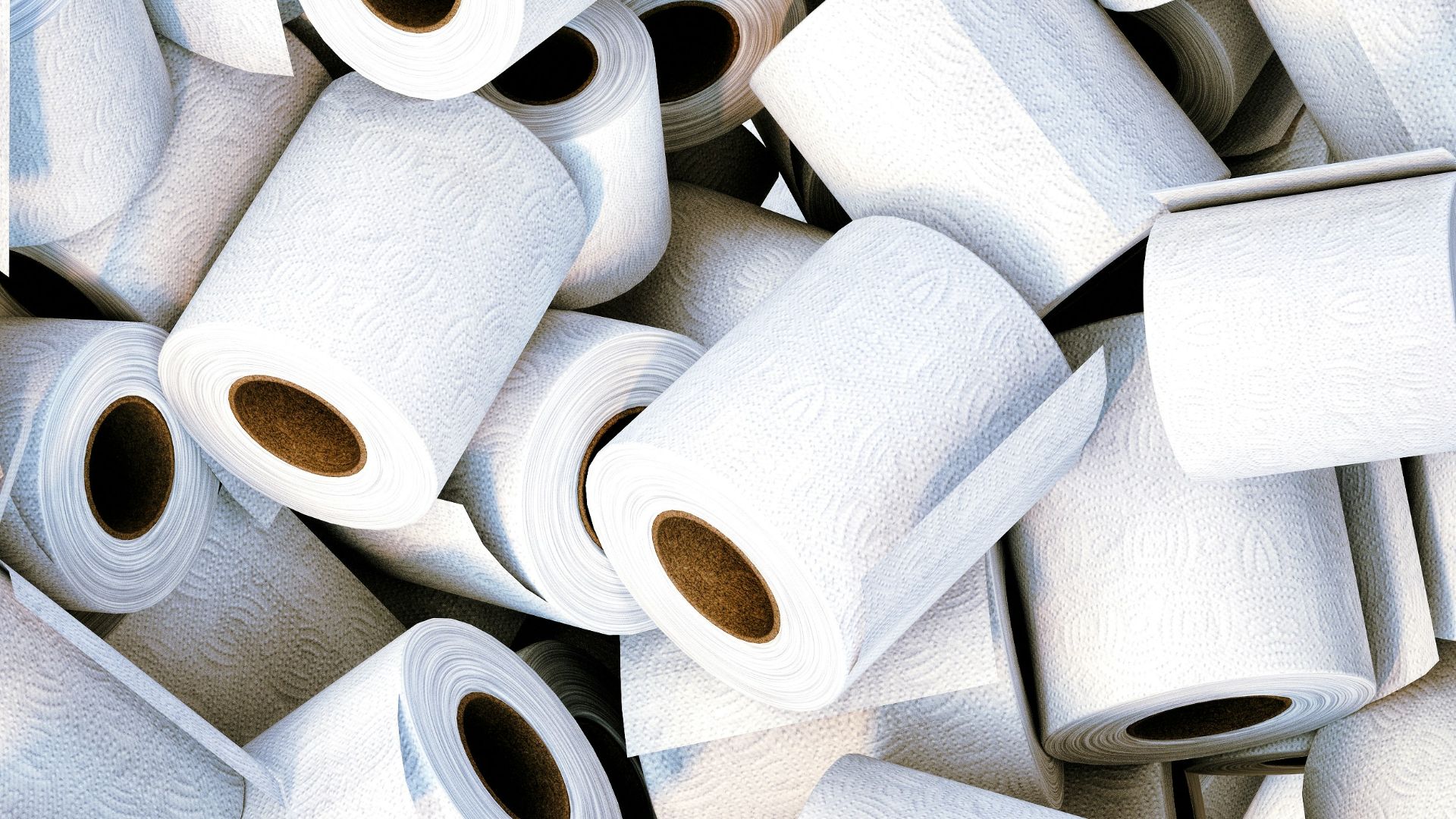 a pile of white toilet paper sitting next to each other