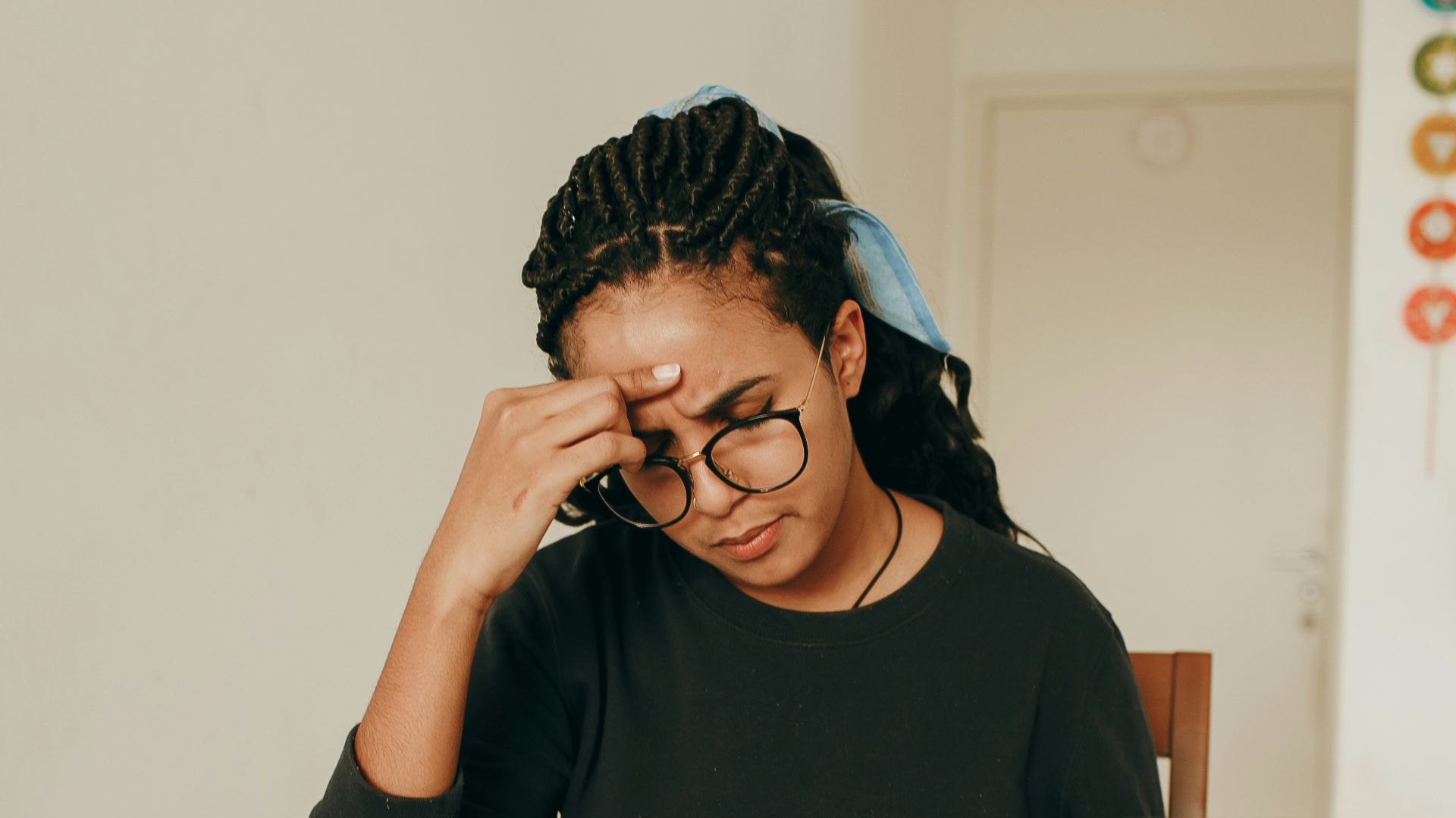 woman in black long sleeve shirt sitting on chair