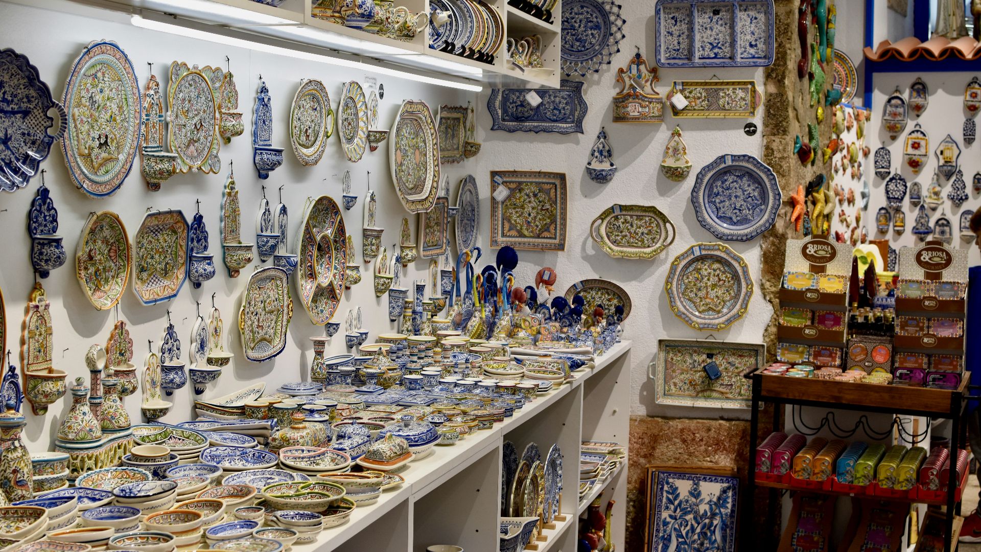a room filled with lots of blue and white plates