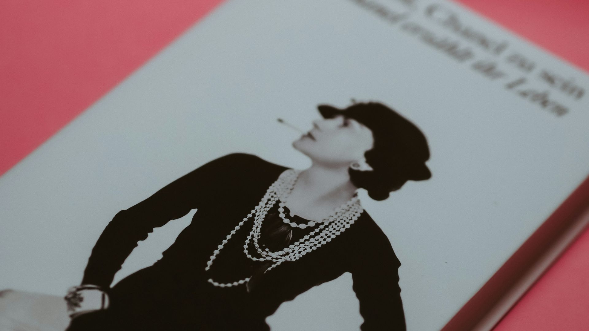 joker playing card on red textile