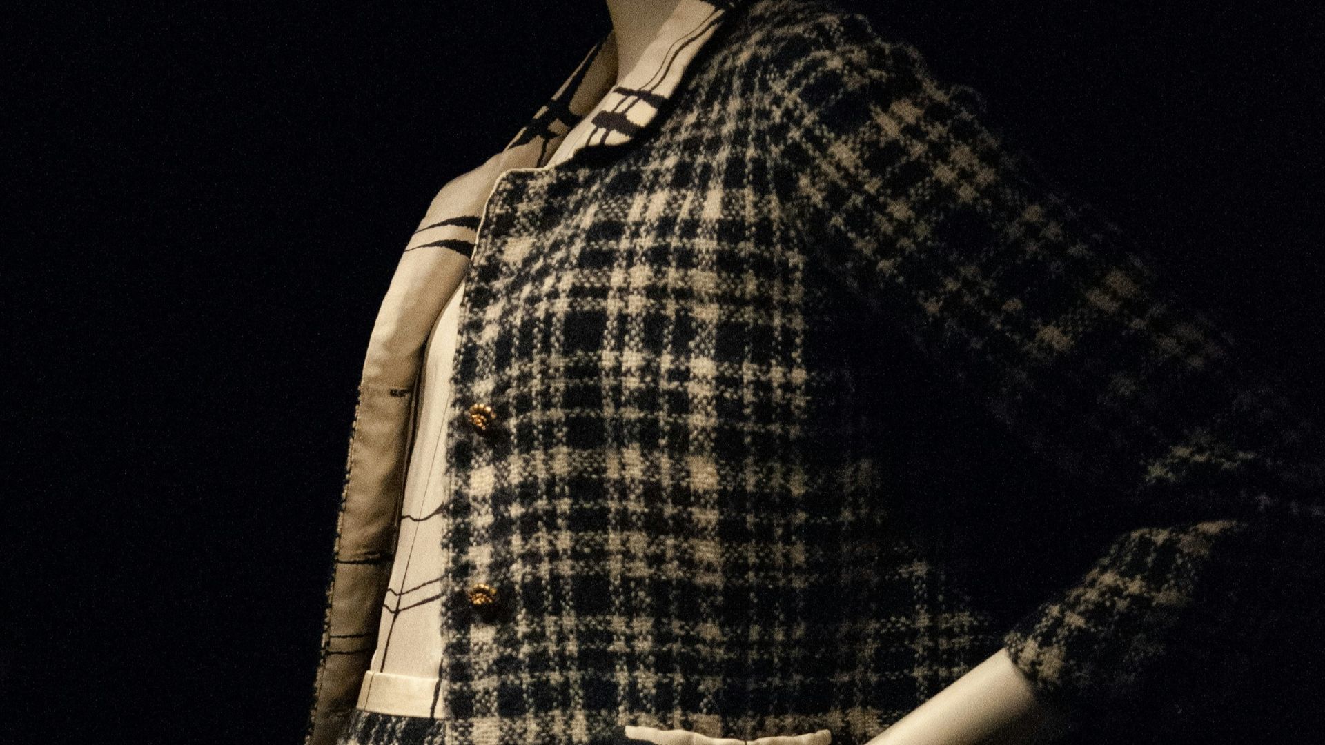 woman in black and white plaid dress