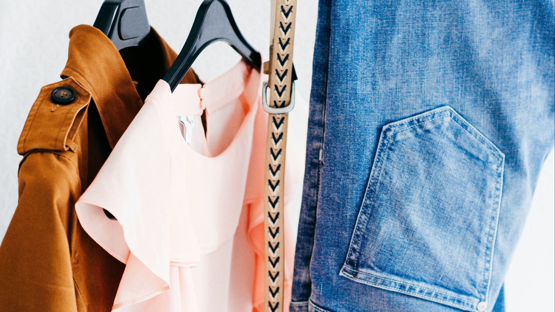 women's four assorted apparel hanged on clothes rack