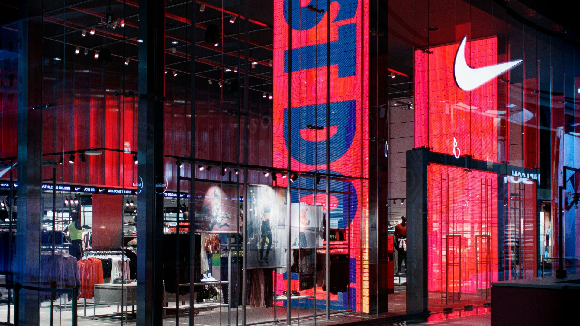 a nike store with red and blue lighting