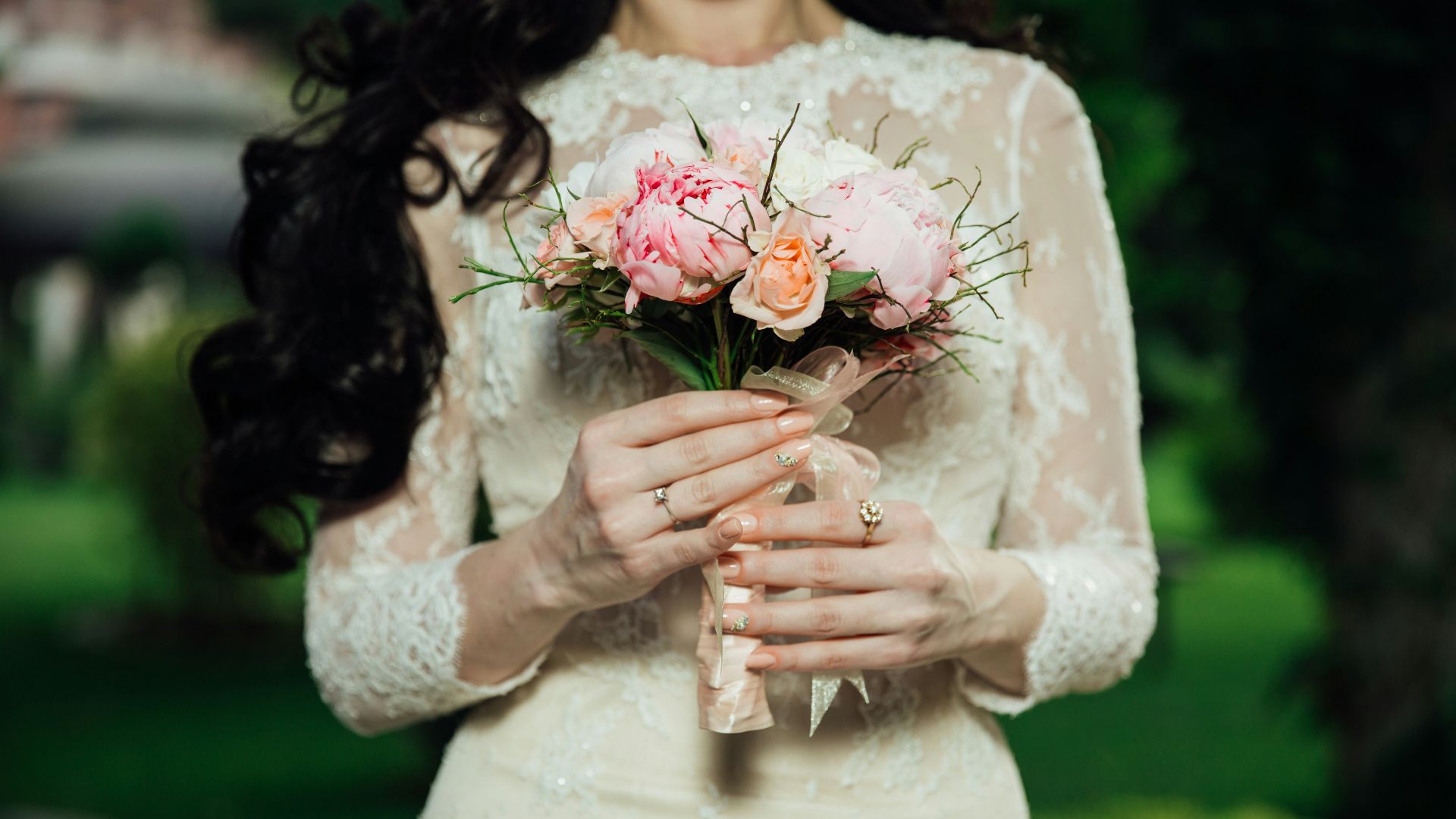 woman wearing white lace long-sleeved wedding dress