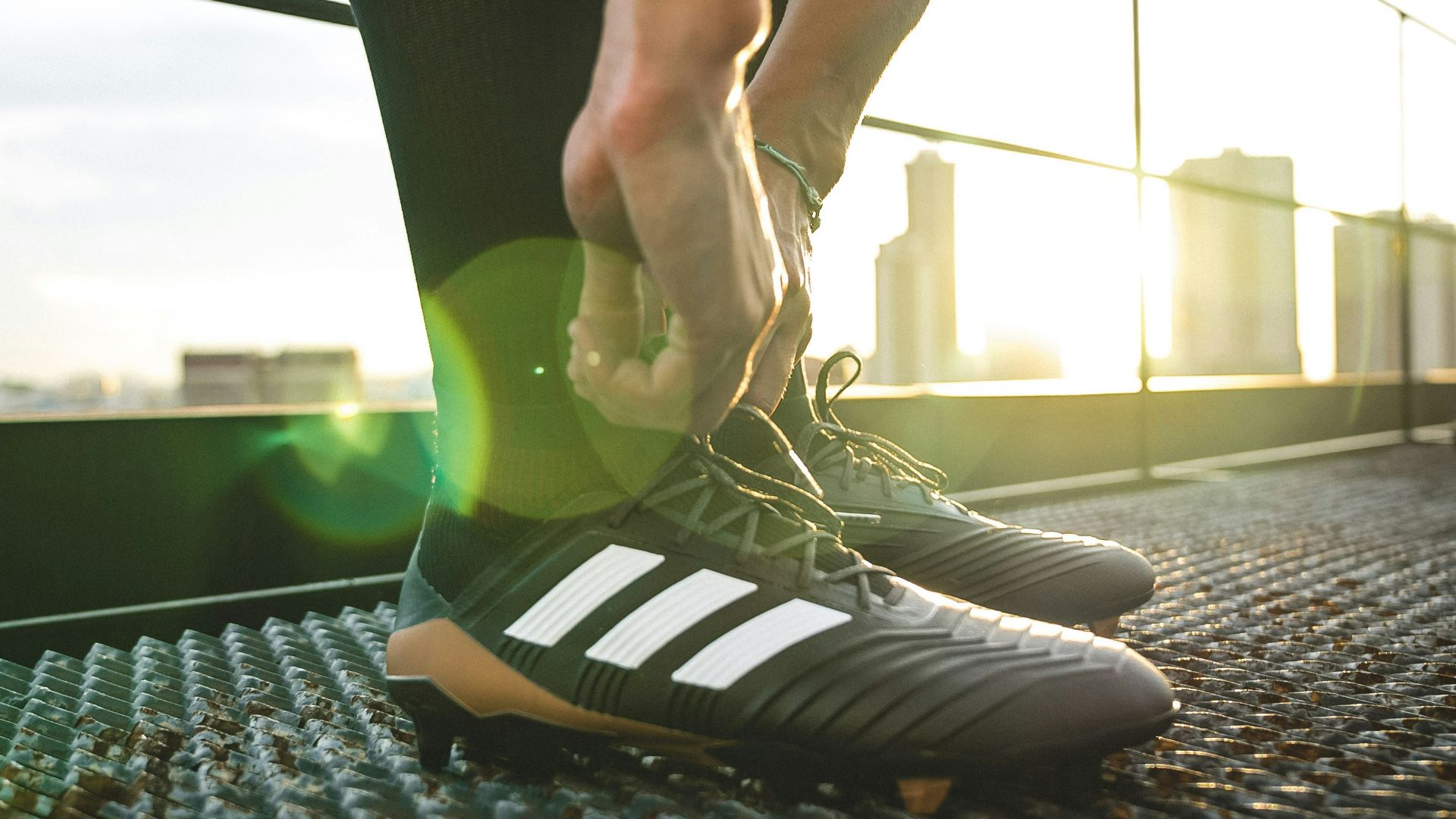 man holding shoelaces