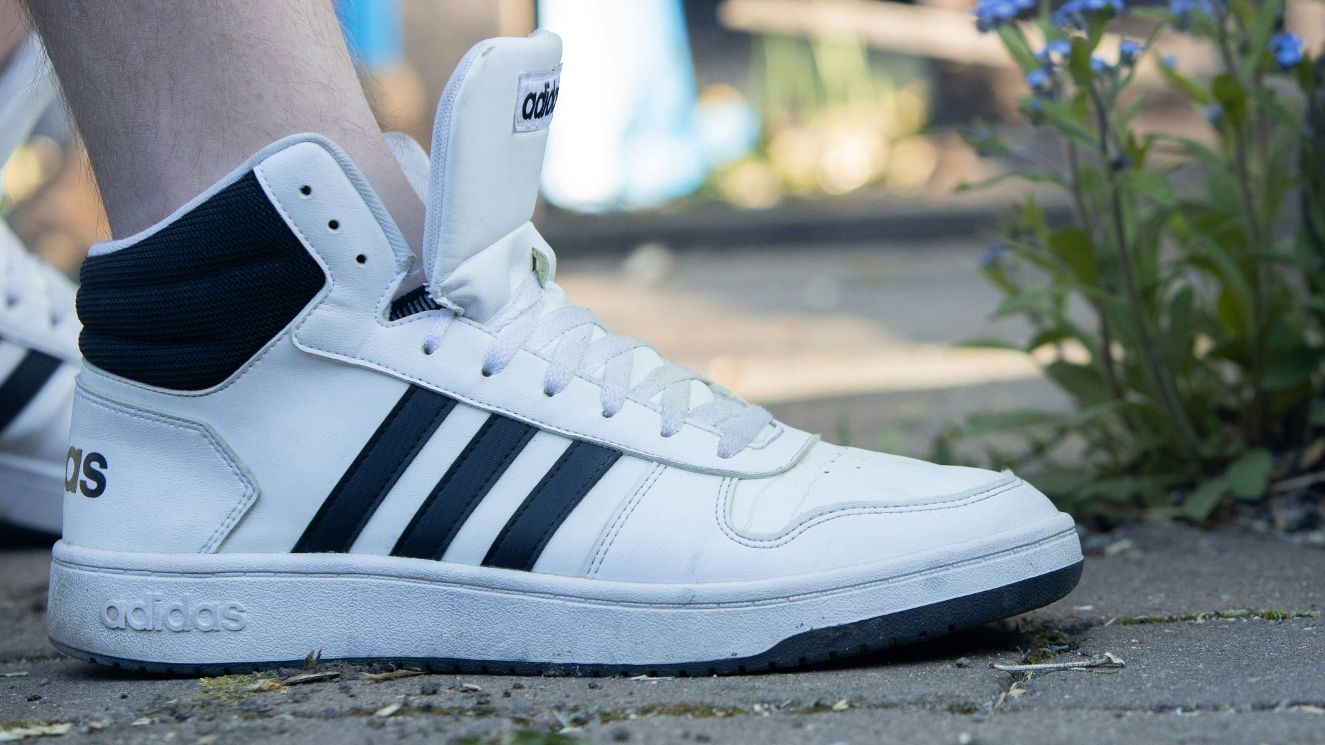 white and black adidas high top sneakers