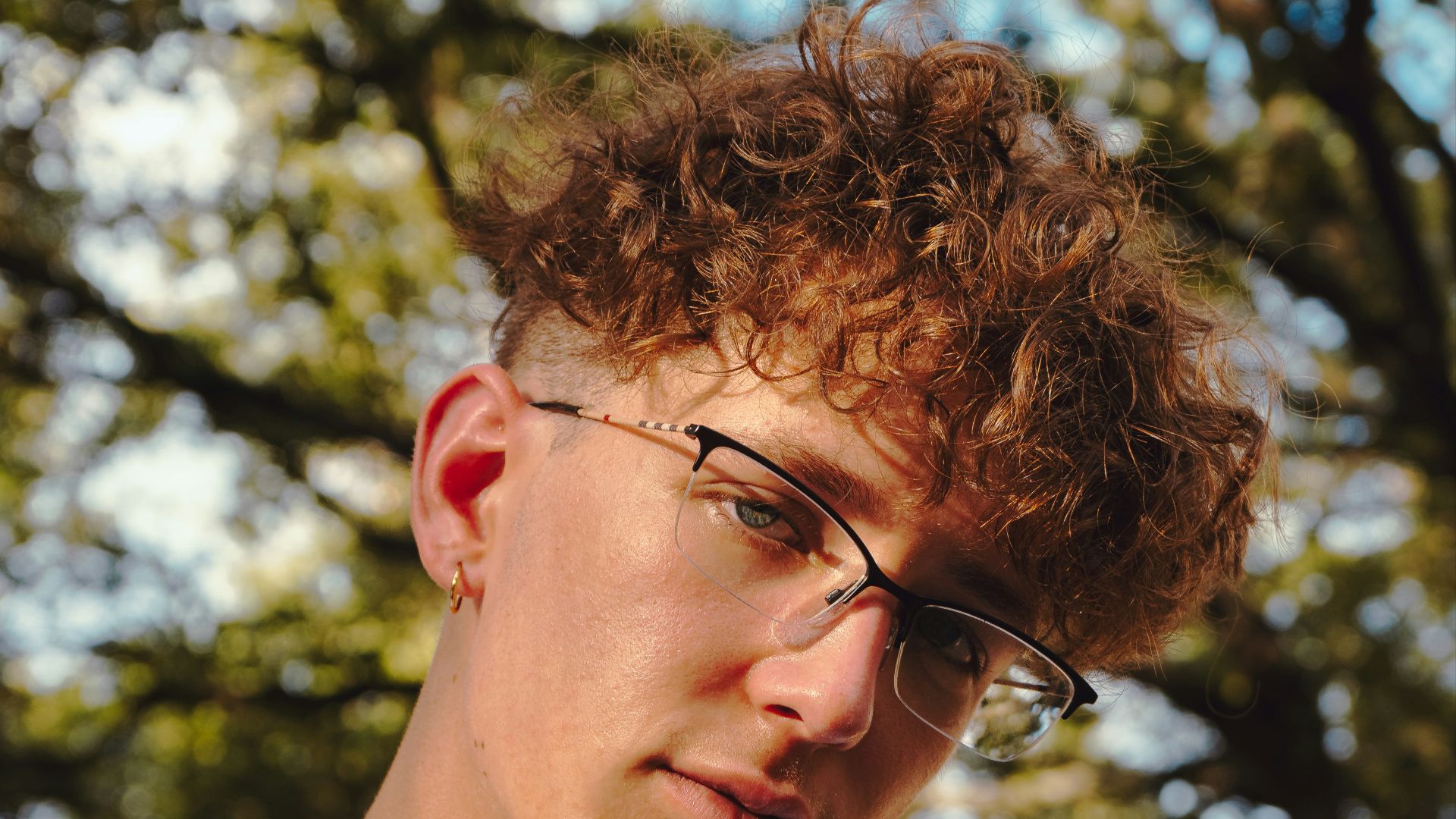 man in white crew neck shirt wearing eyeglasses