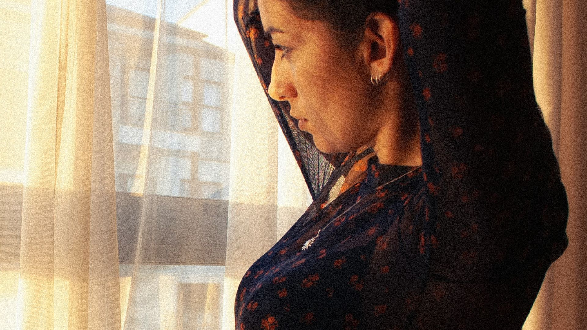 a man looking out a window