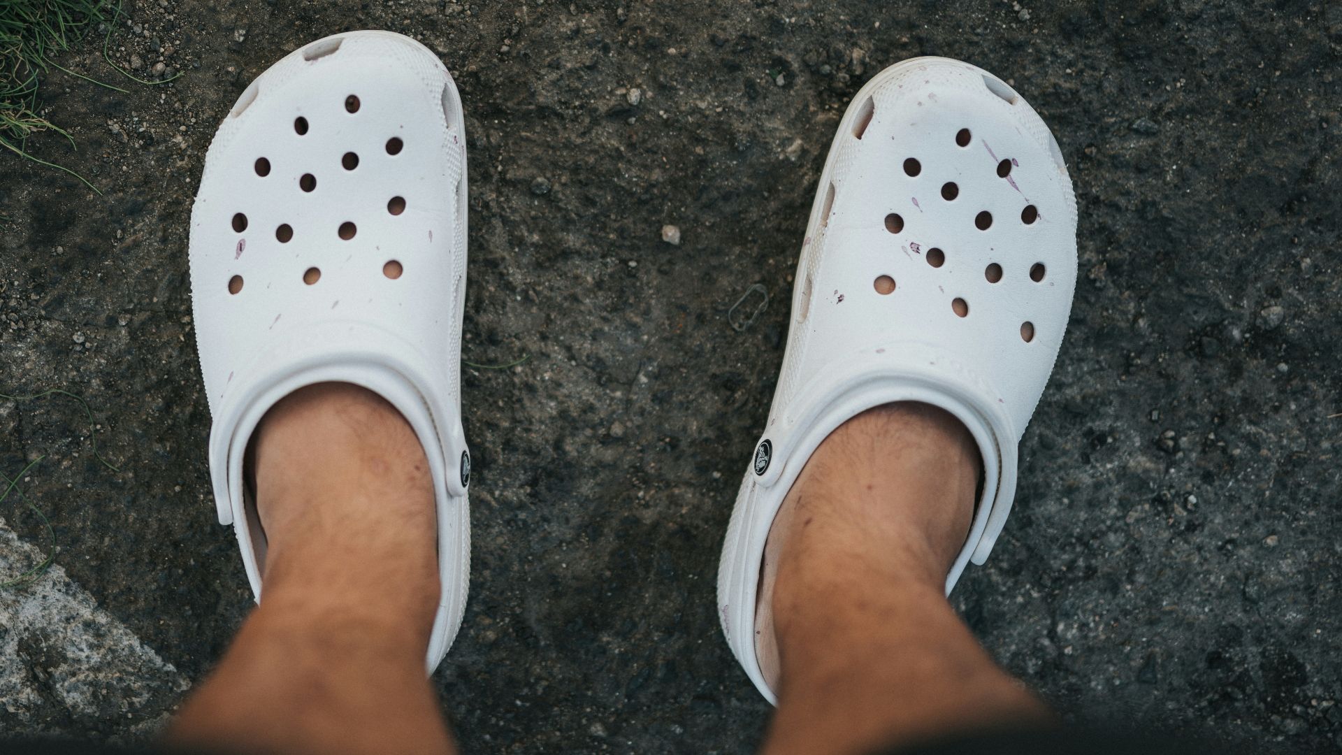 person wearing white rubber clog