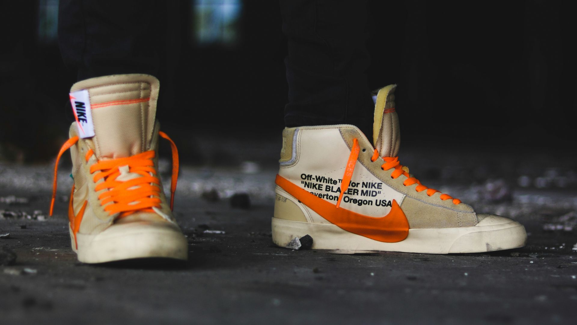 person wearing gray Nike shoes