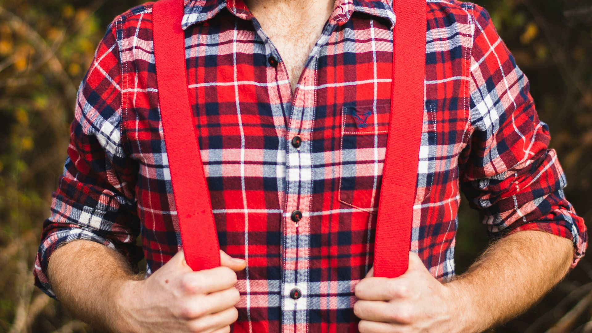 standing man wearing red and white floral kerchief close-up photo