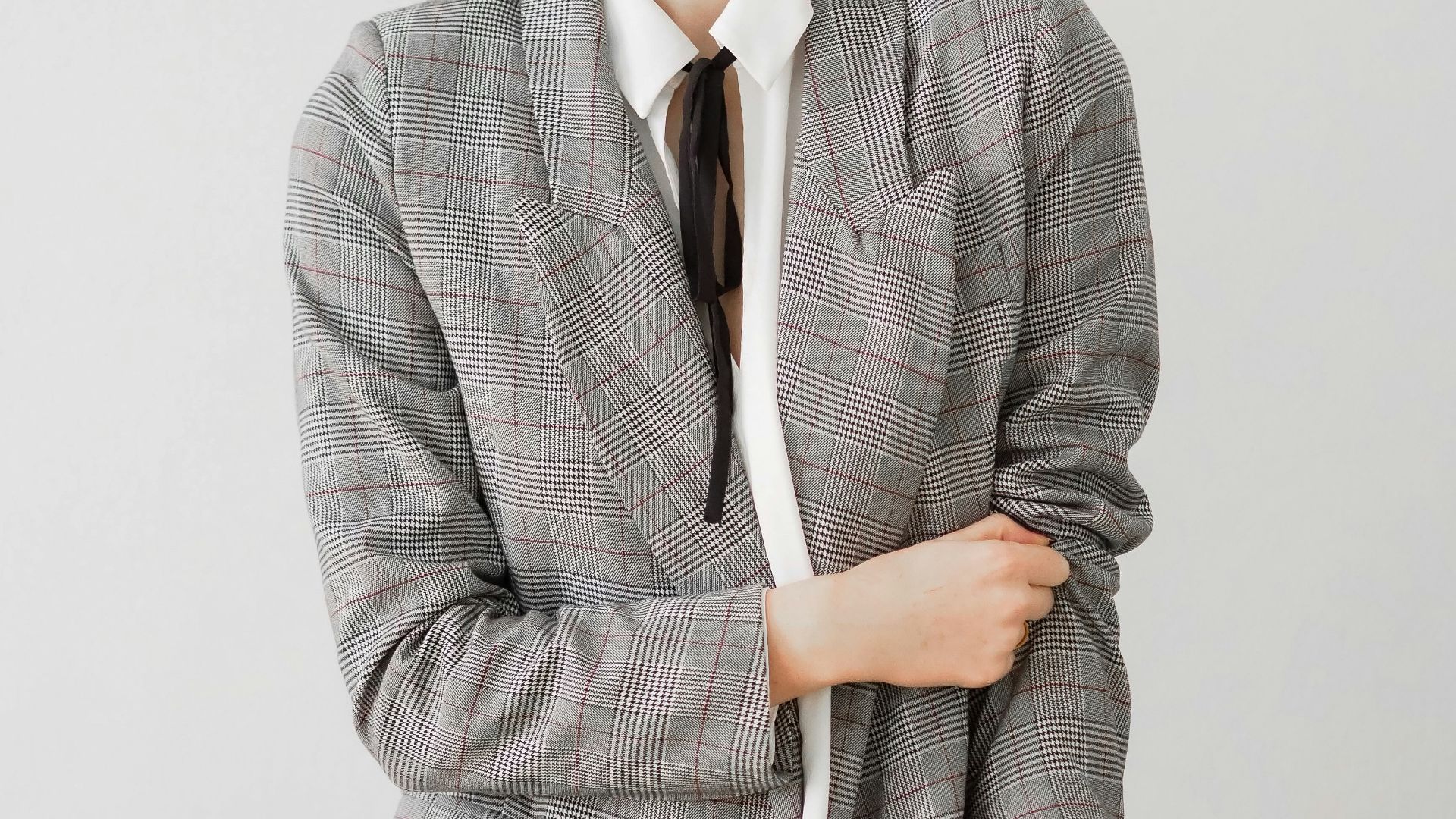 woman in gray blazer and black pants