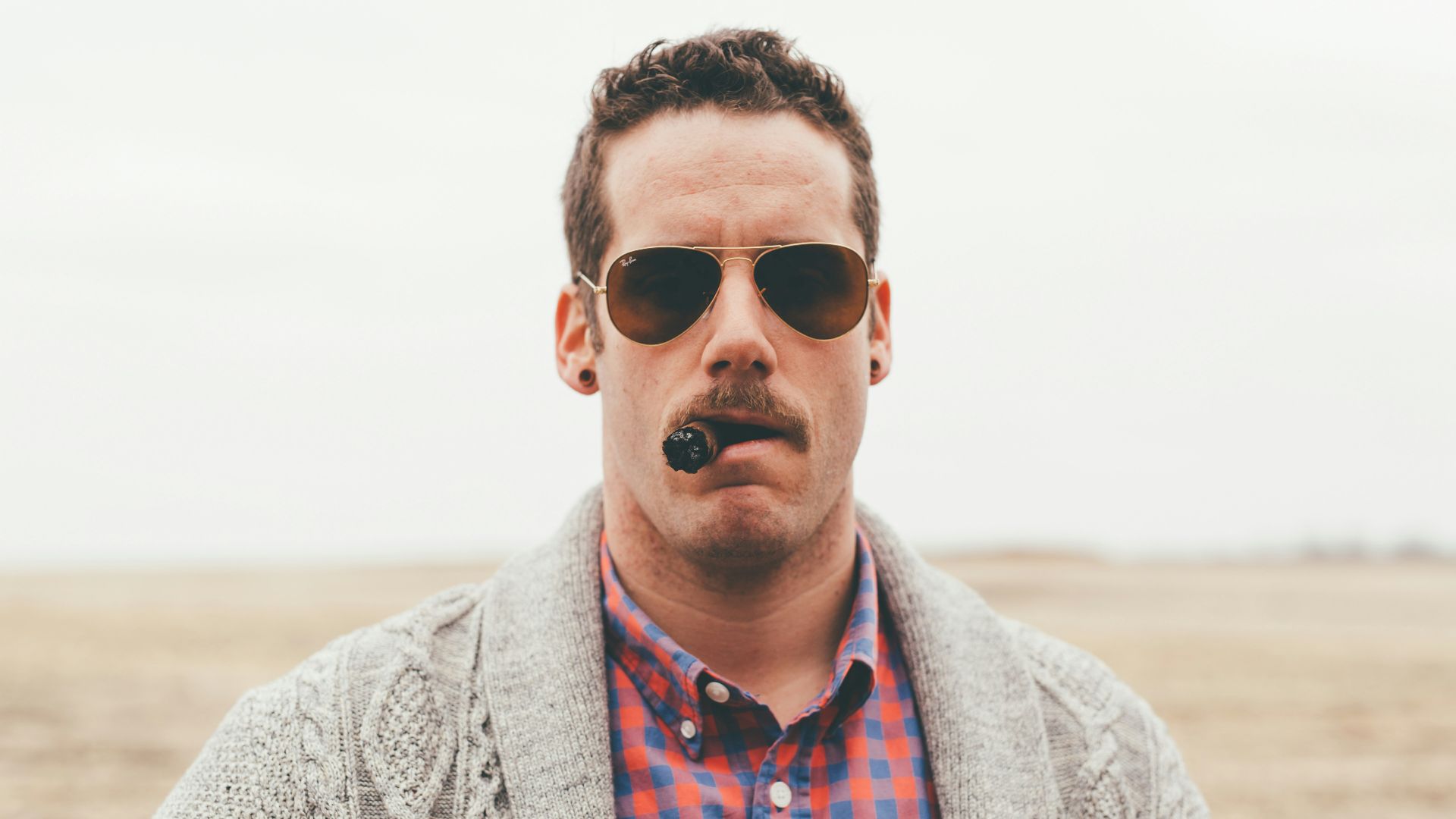 photography of man using tobacco