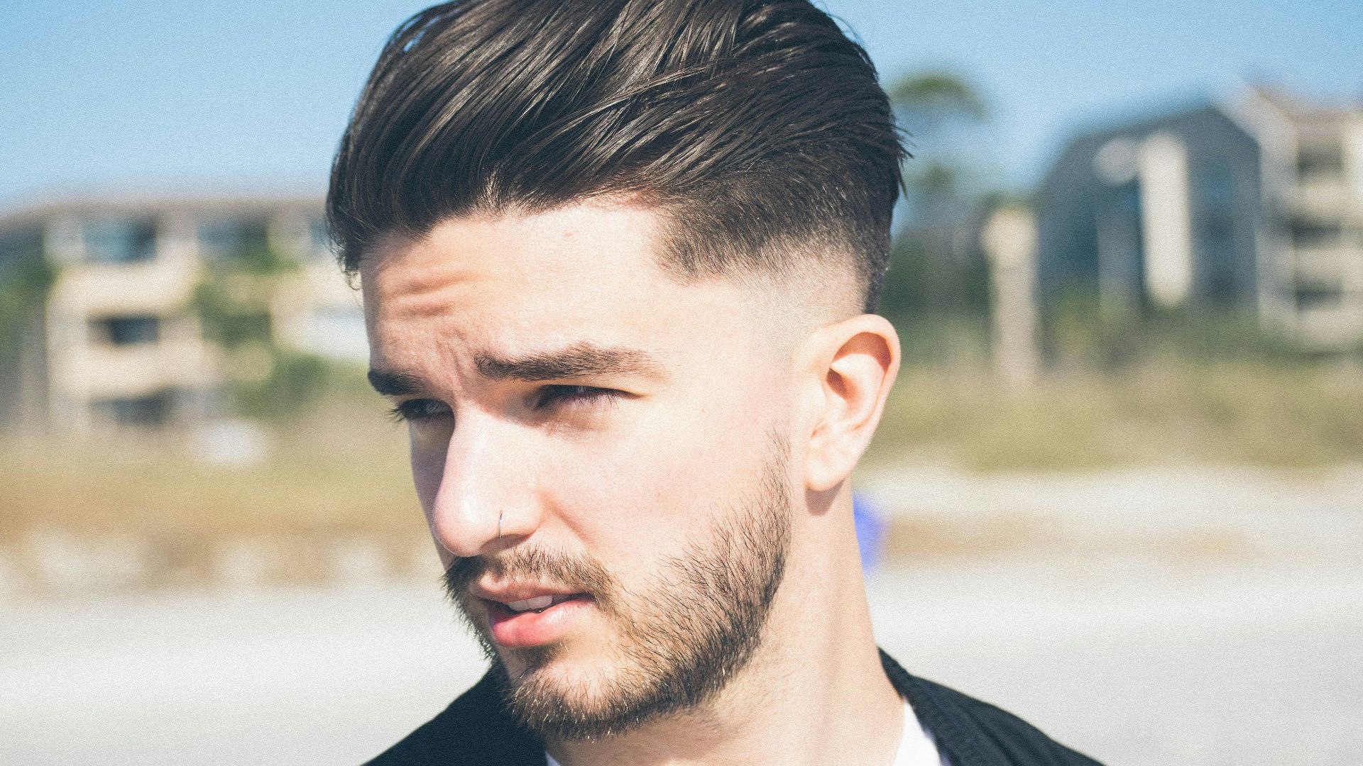 selective focus photography of man wearing black suirt