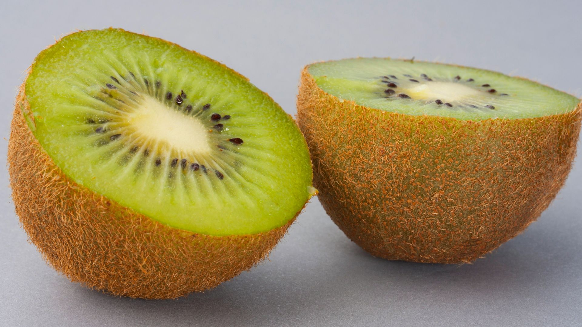 sliced green fruit on white surface