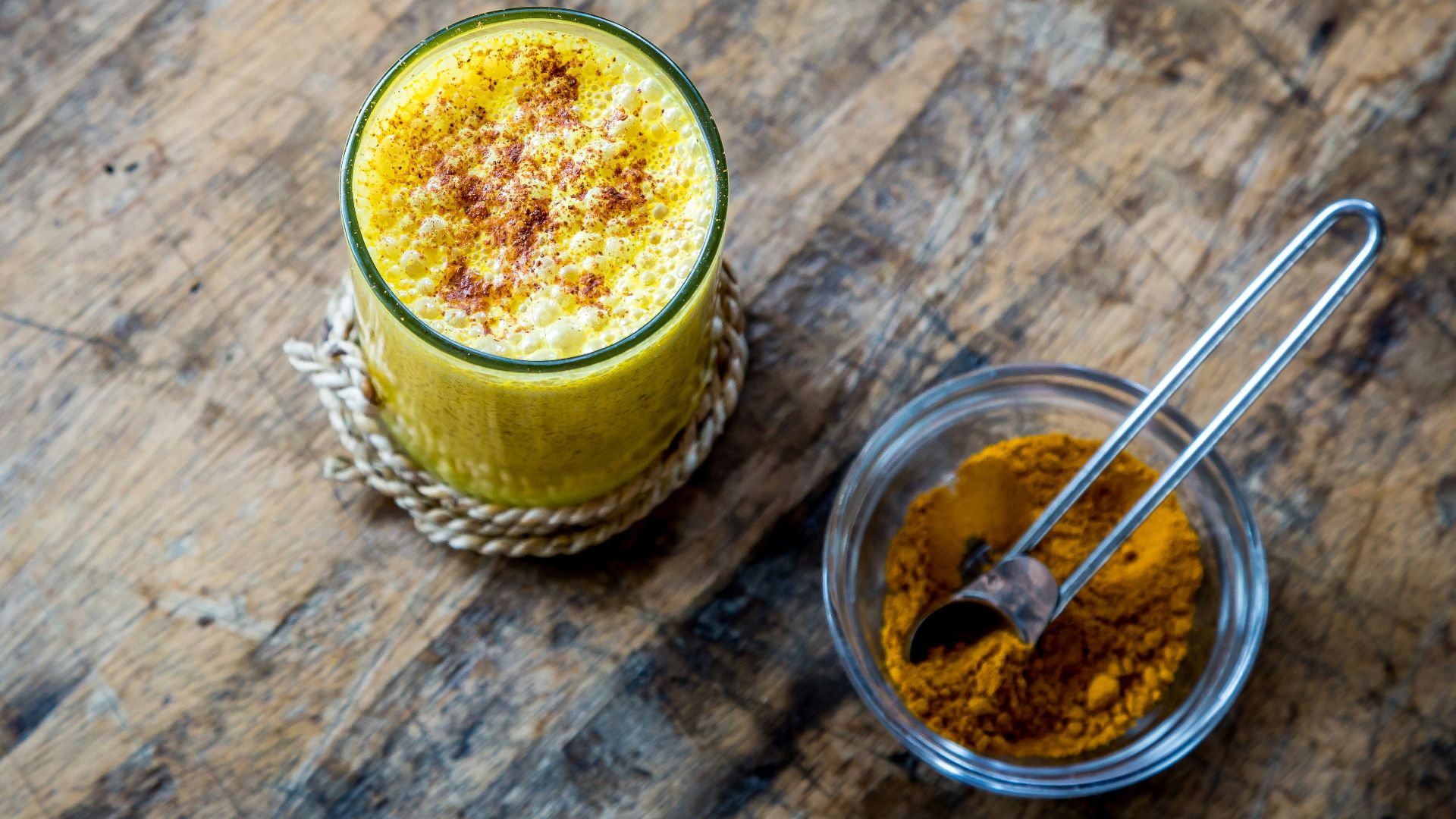 clear drinking glass full of orange liquid