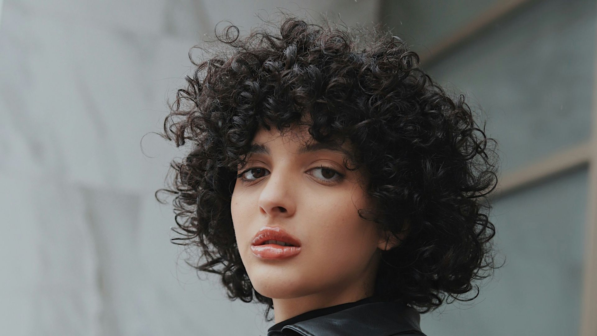 woman in black leather jacket