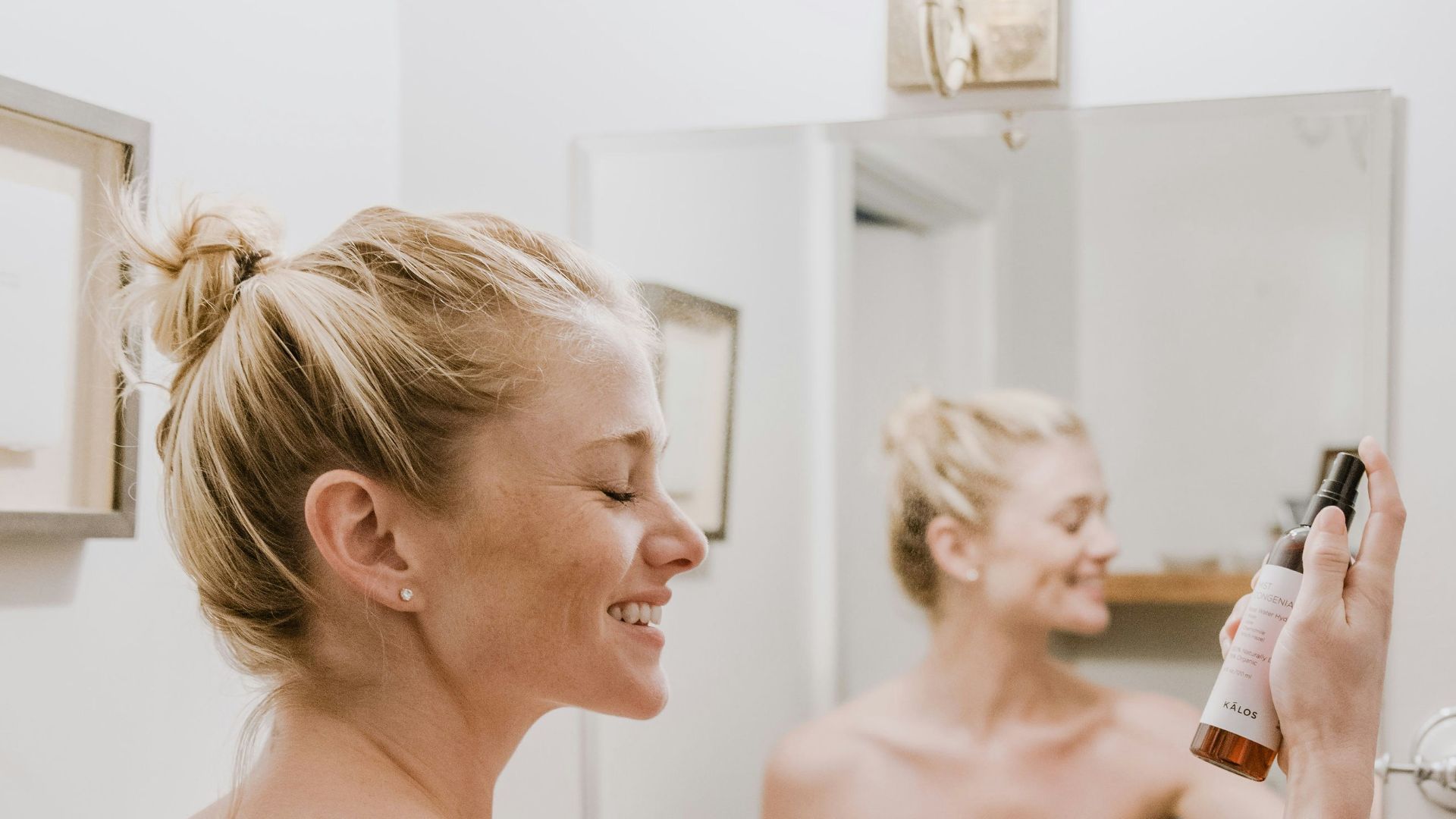 woman in white towel holding mans hand