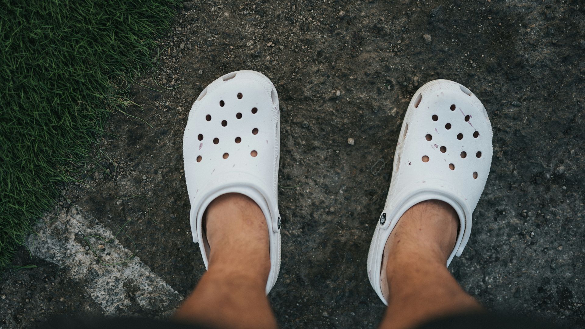 person wearing white rubber clog