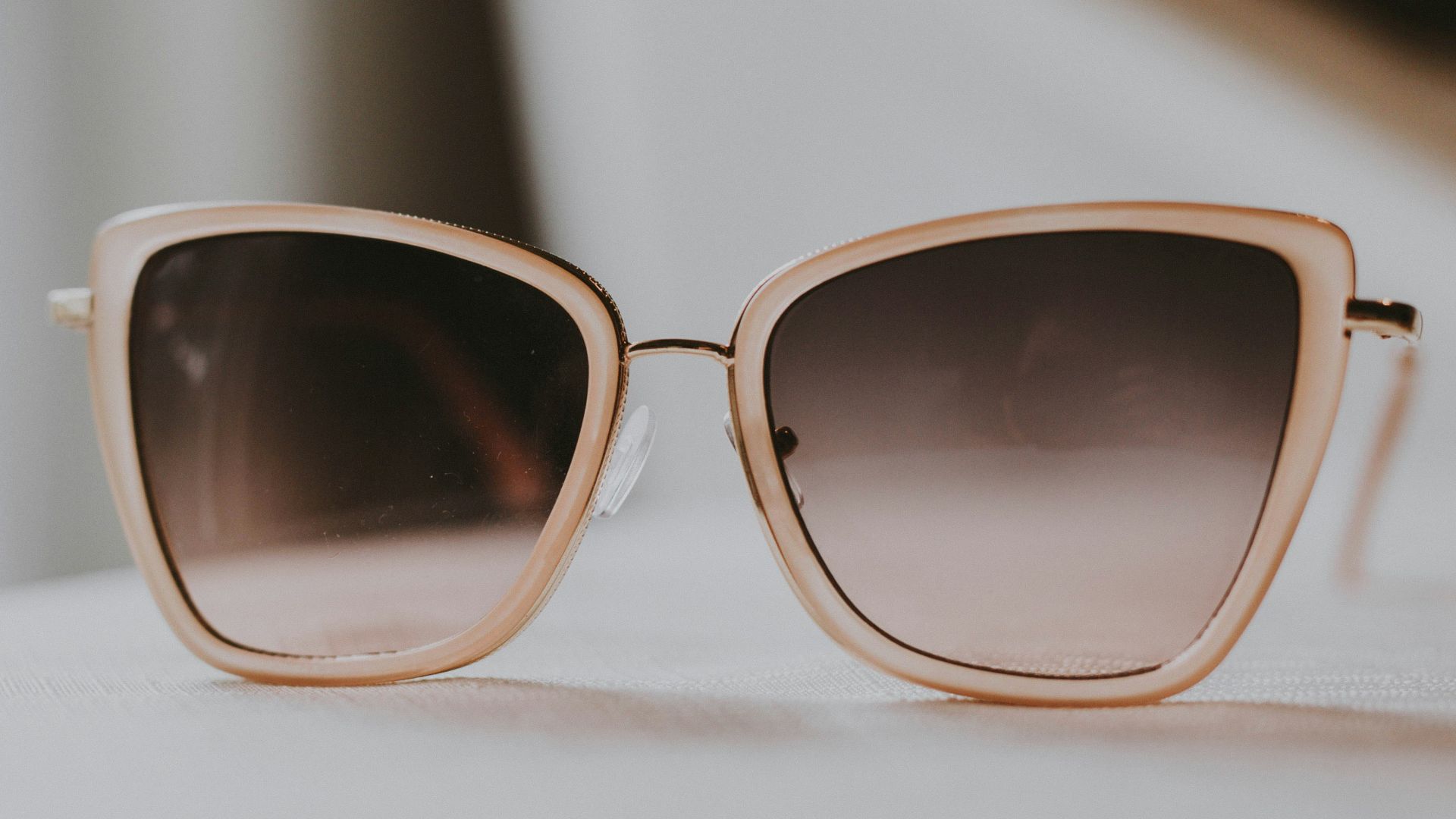 gray sunglasses with white frames