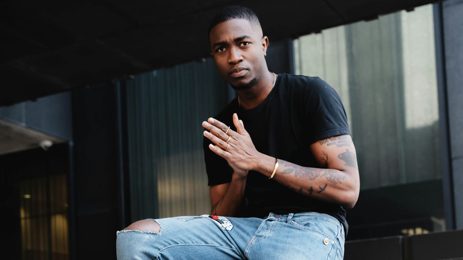 man sitting on concrete steps