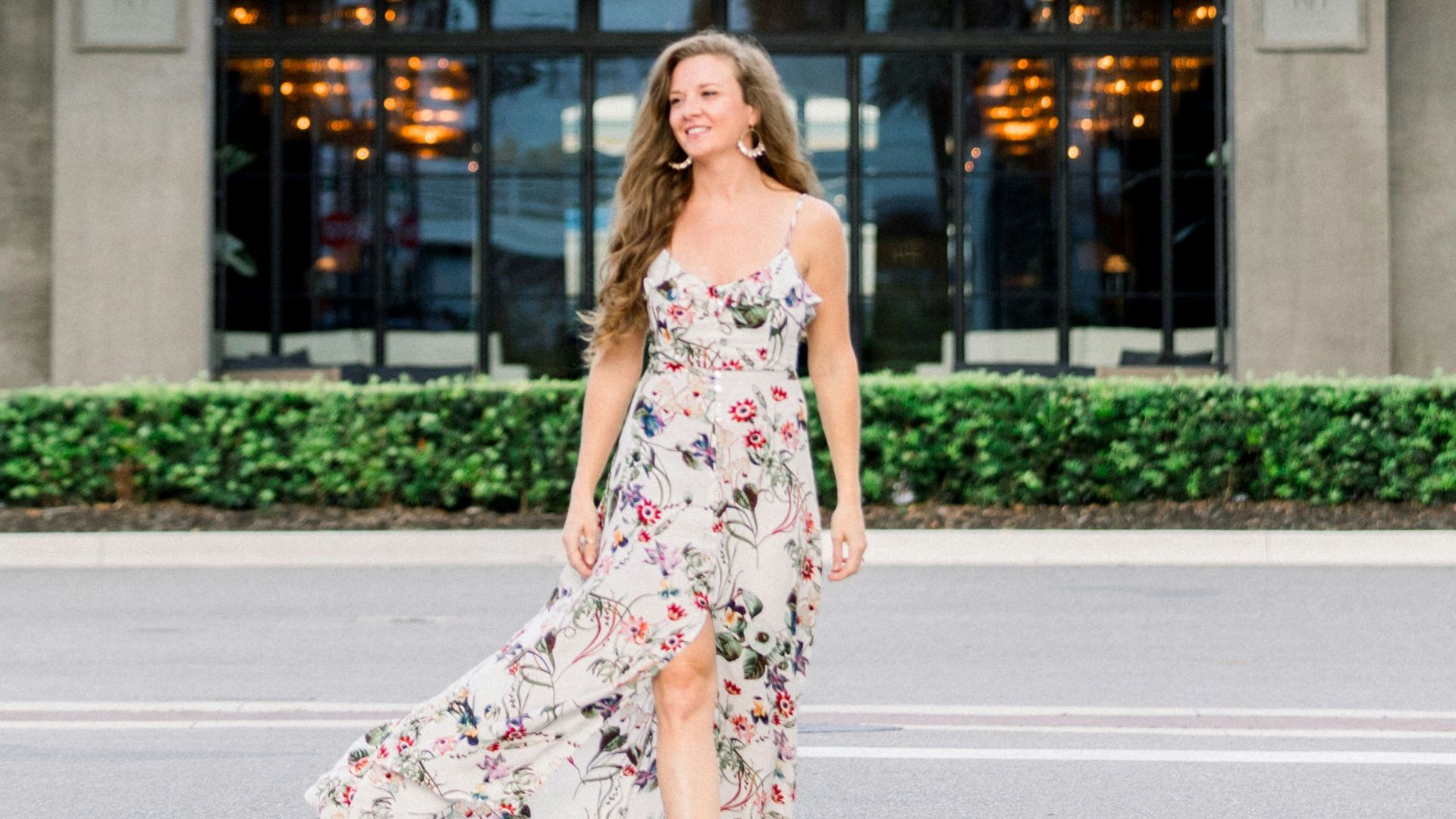 a woman standing in front of a building