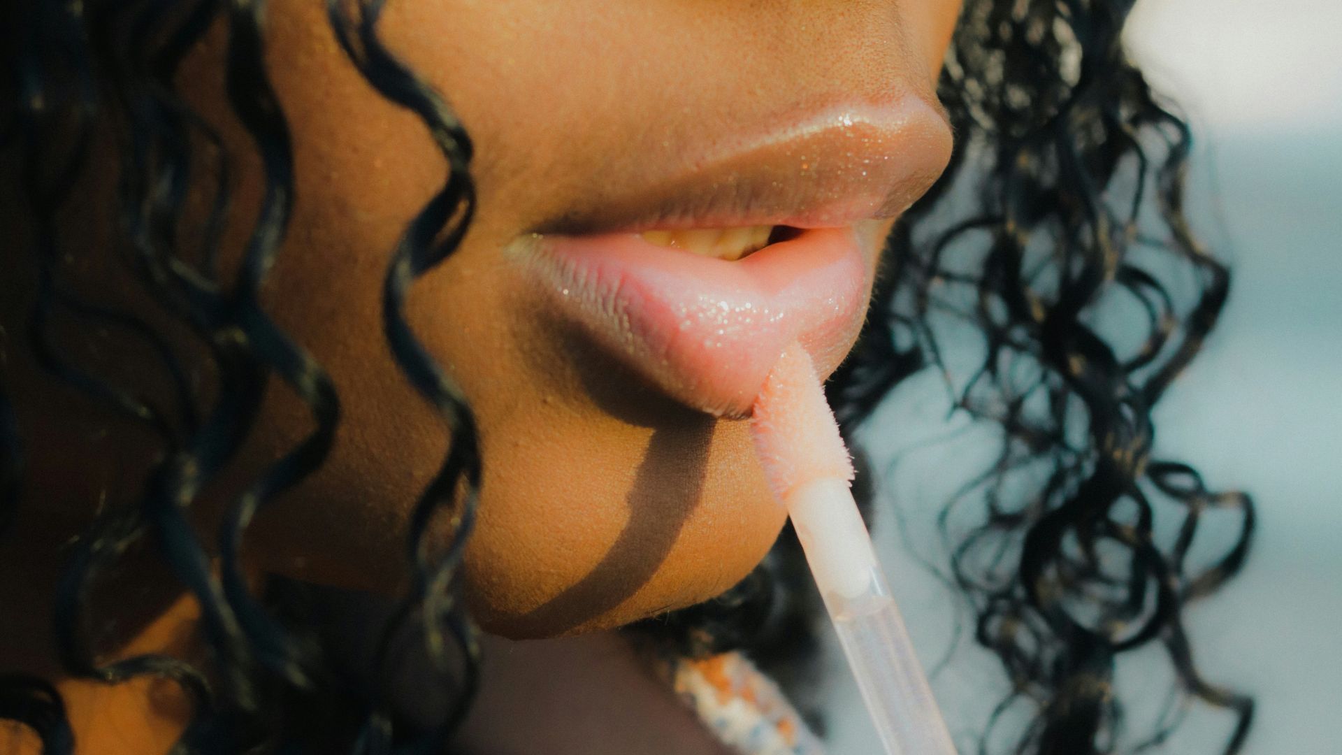 a close up of a person holding a toothbrush