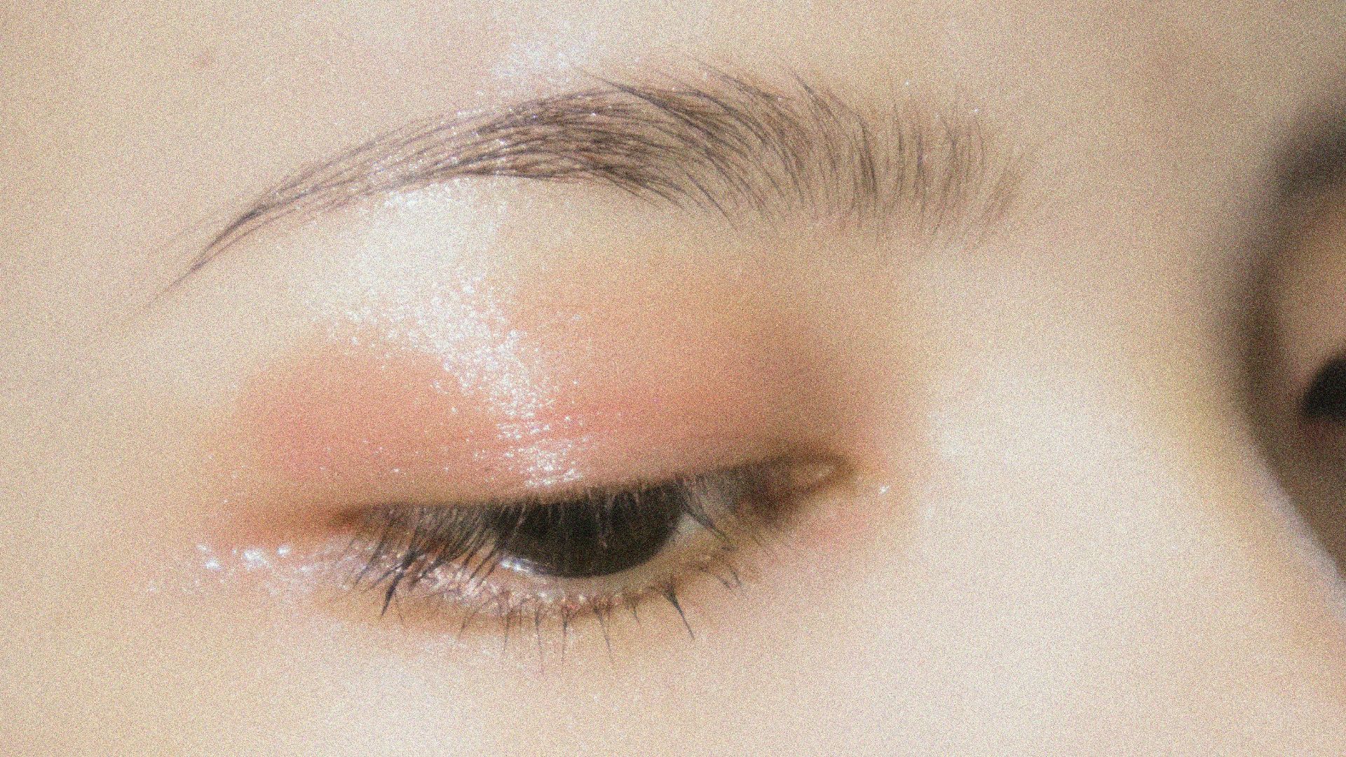 a close up of a woman's eye with makeup