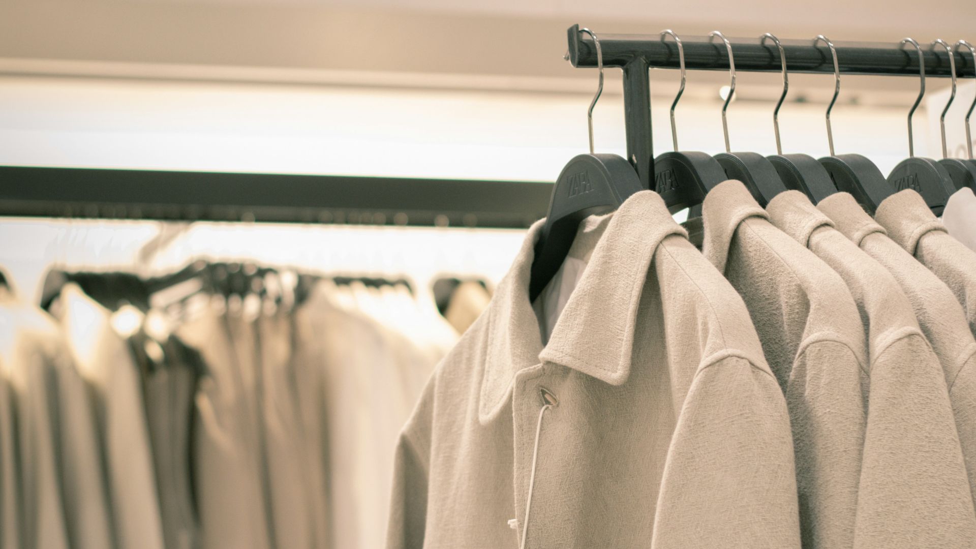 a rack of clothing with a tag on it