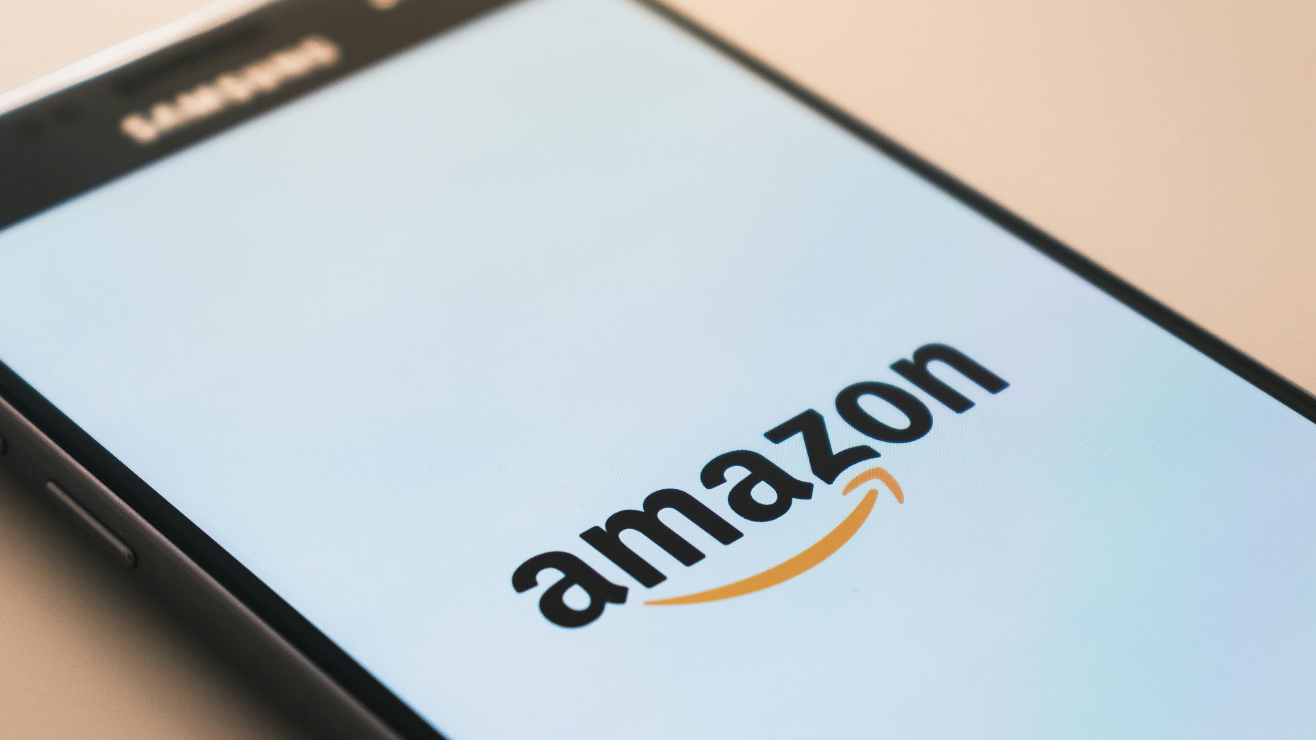 black Samsung Galaxy smartphone displaying Amazon logo