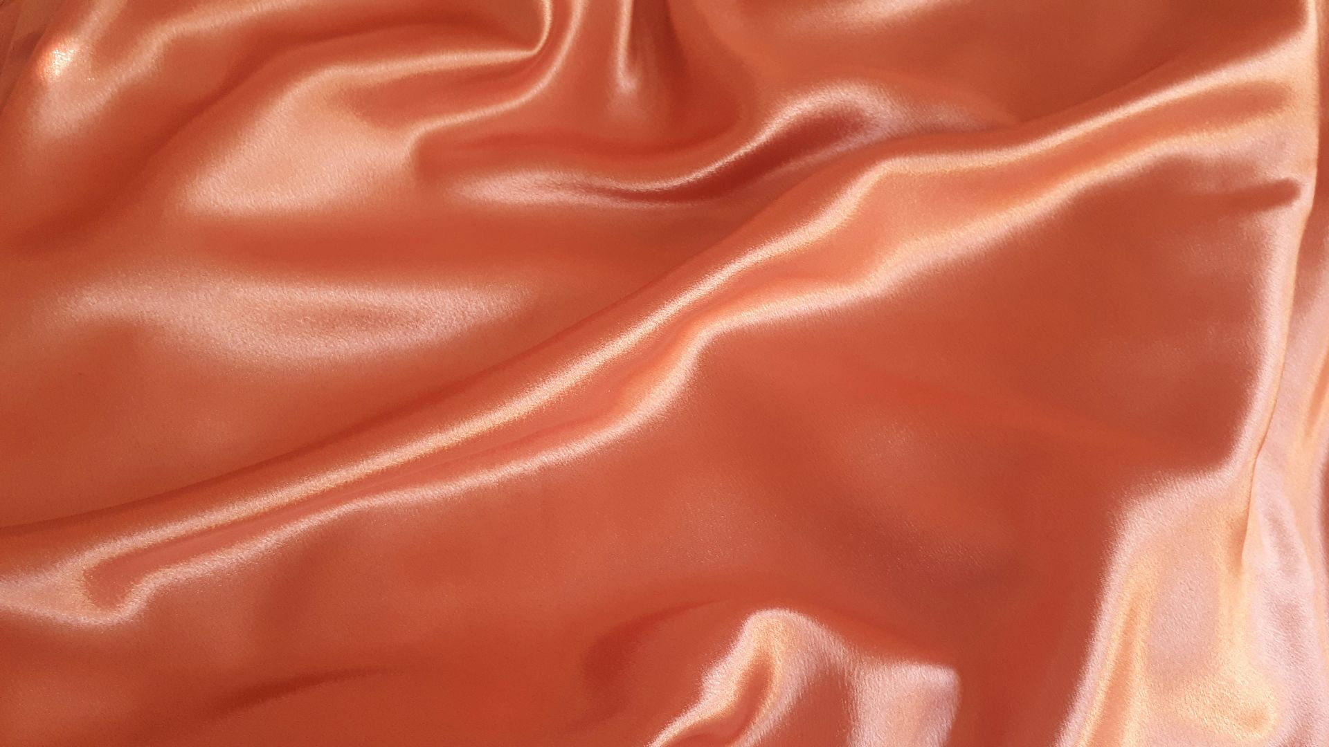 orange textile close-up photography