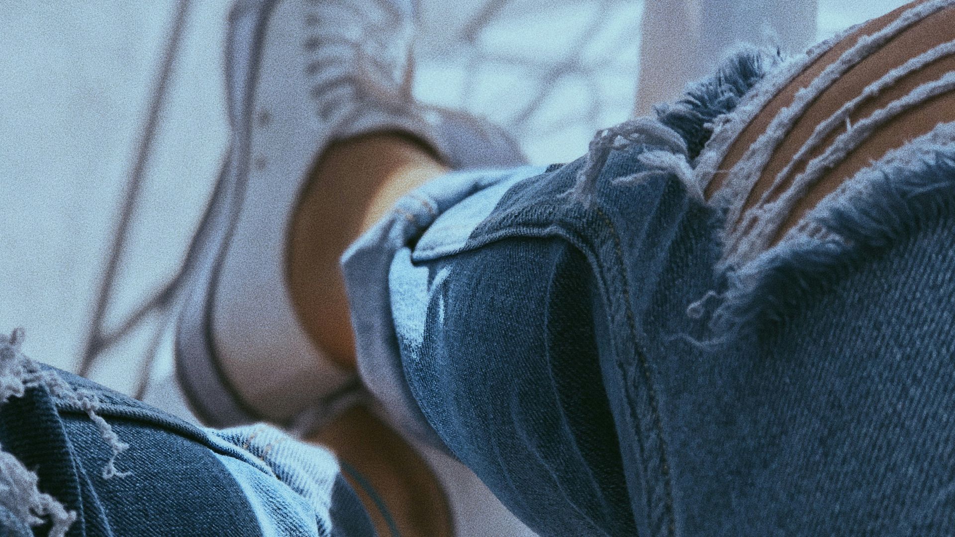 a person sitting on top of a metal pole