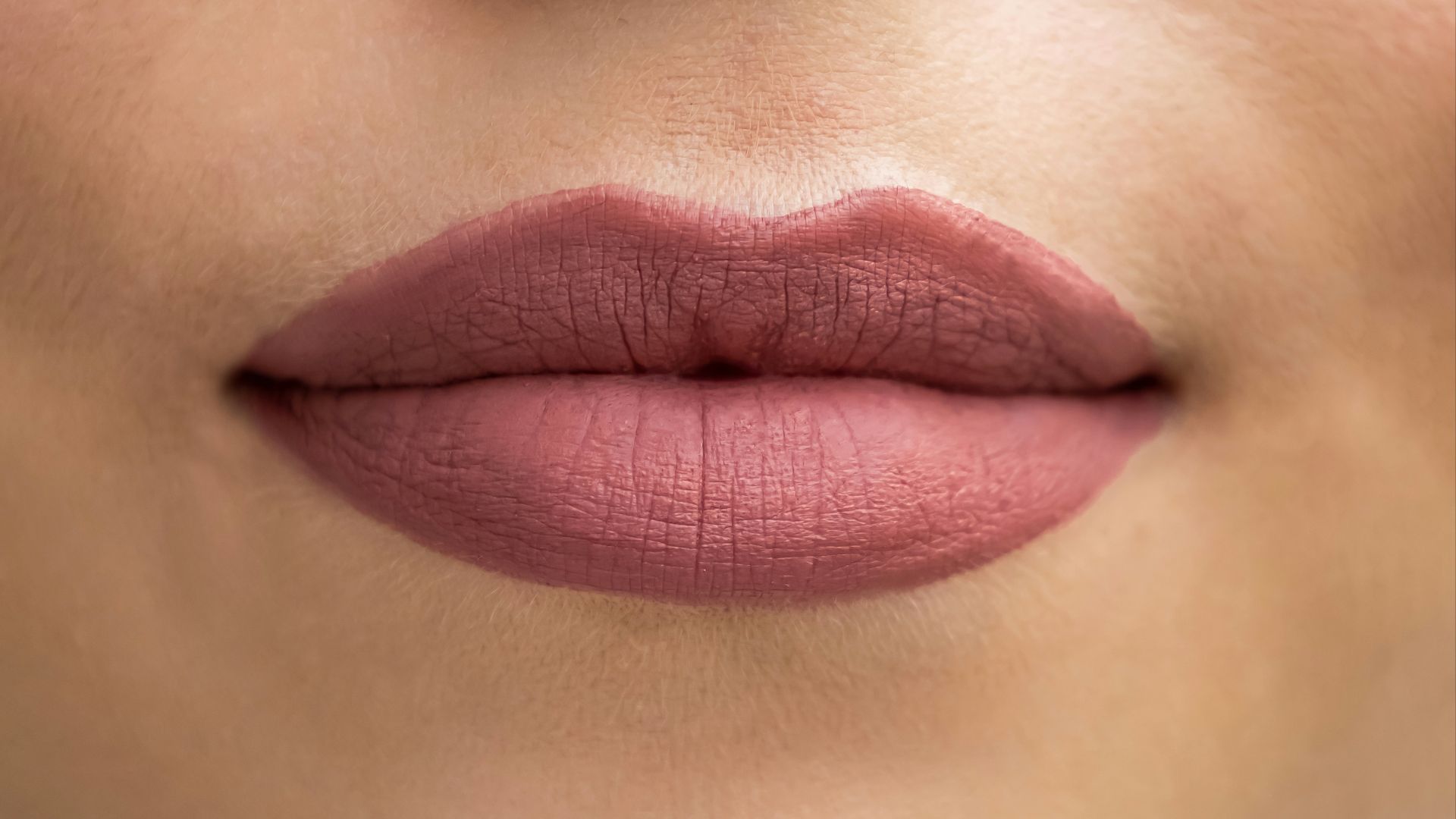 a close up of a woman's lips and nose