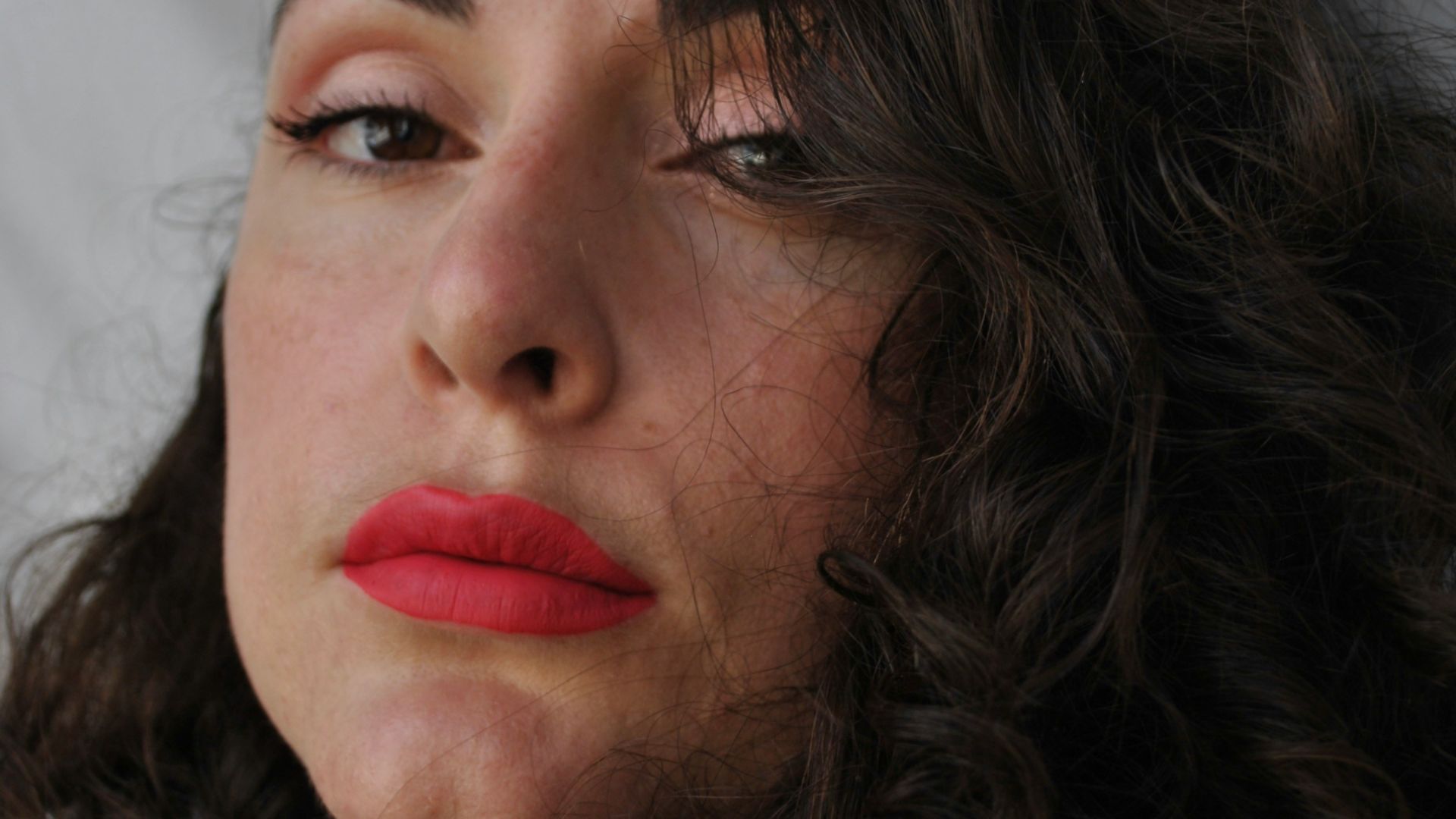 woman with red lipstick and black hair